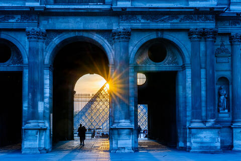 Sunlit Louvre: Arches and Silhouettes