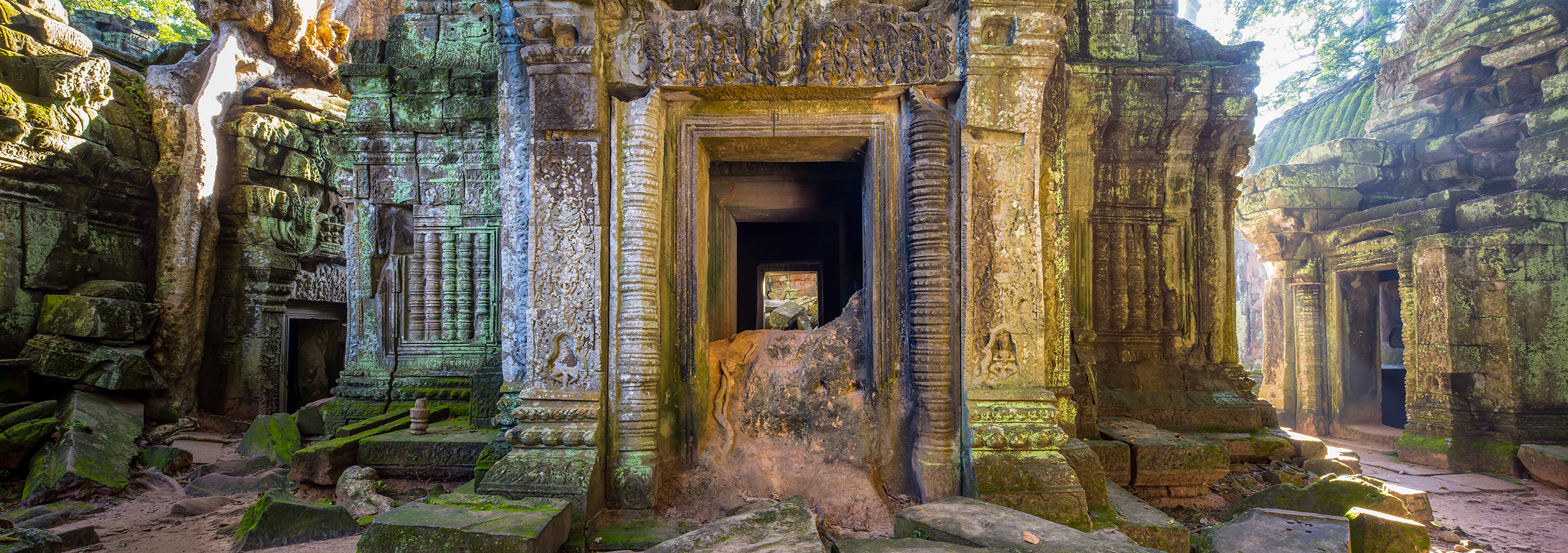 This striking three-image panoramic shot captures the essence of the Ta Prohm temple complex in Cambodia, evoking memories of...
