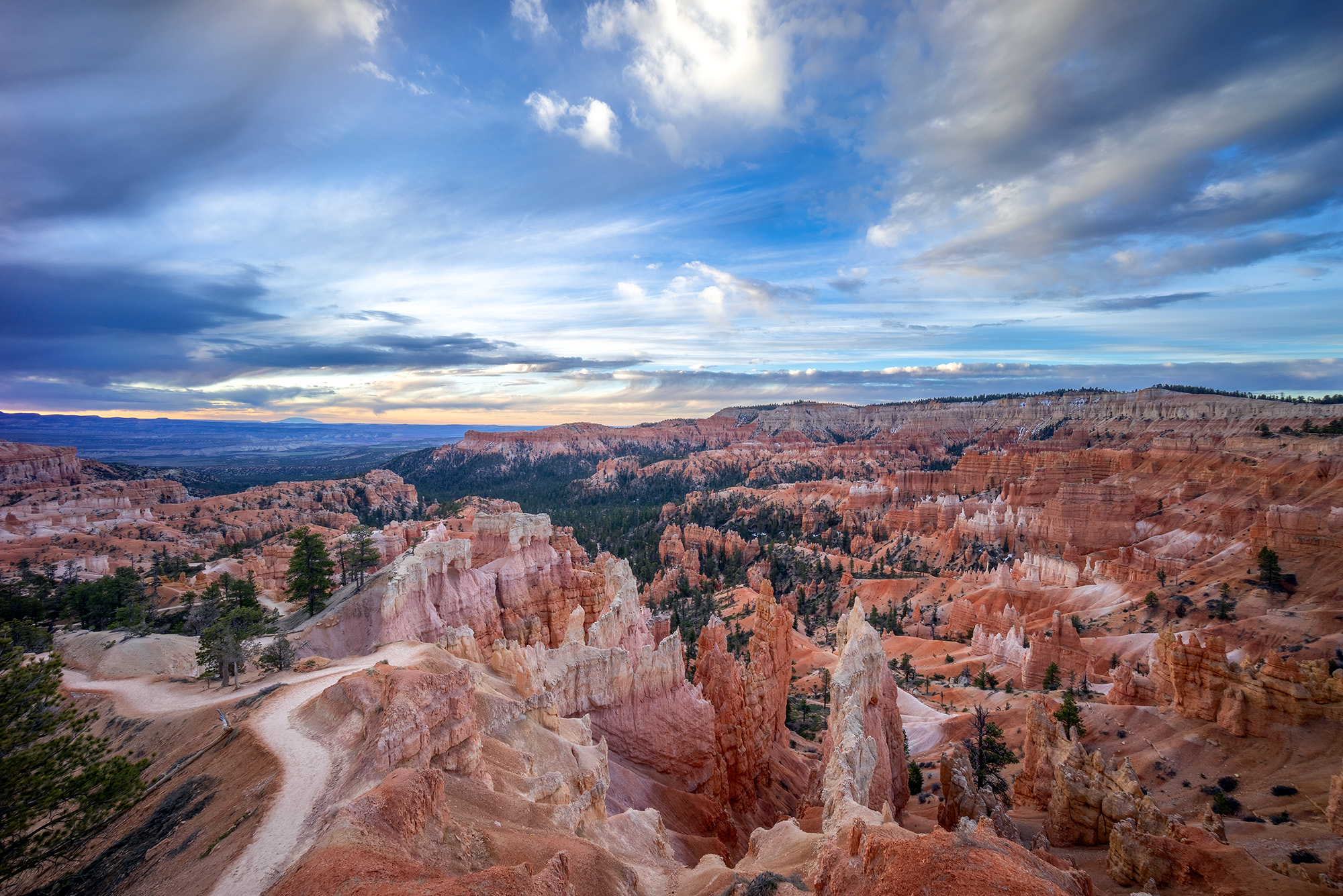 Bryce Canyon Before Sunrise In the even early morning light of Bryce Canyon National Park's Queens Garden Trail, a mesmerizing scene unfolds. Vivid red and...