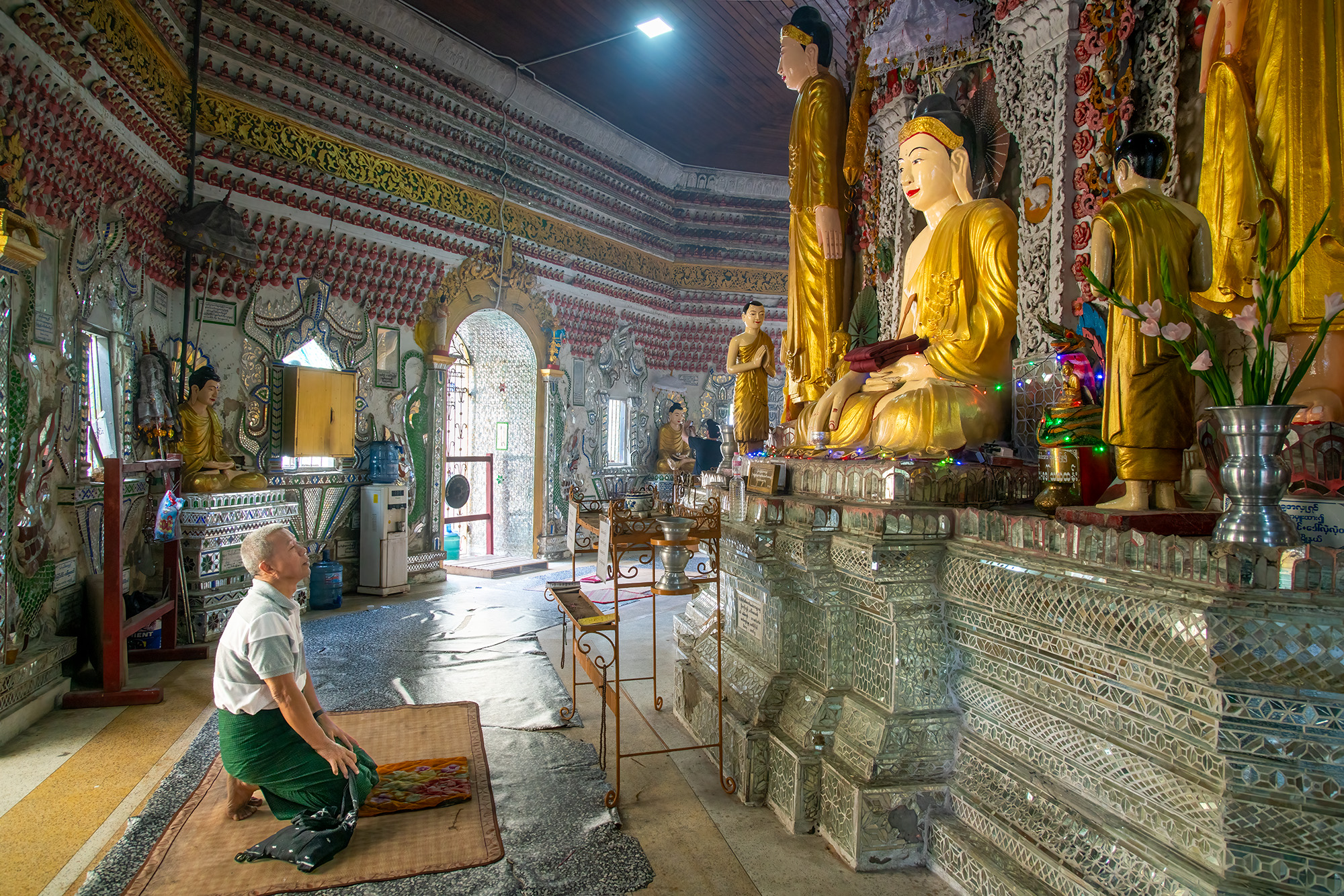 In this heartfelt image, my dear friend Win kneels in devotion within a Yangon Buddhist temple. Win has been a cherished mentor...