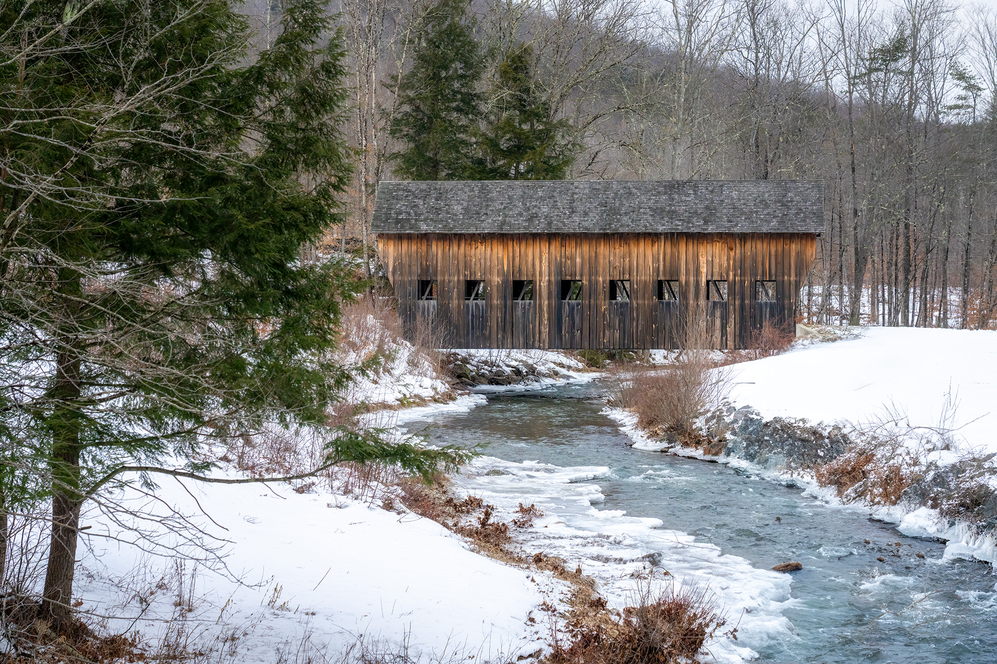 Winter's Gaze on Vermont's Covered Bridge I captured this image of a covered bridge in central Vermont during the winter season. The scene portrays a bitterly cold and...