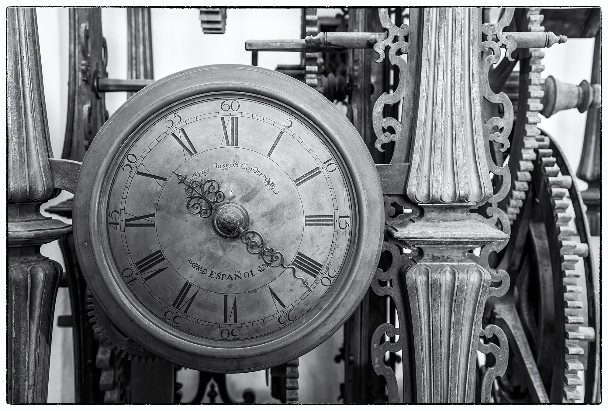 This black and white photograph, discovered in the heart of Sevilla, Spain, showcases the intricate beauty of a timeless clock...