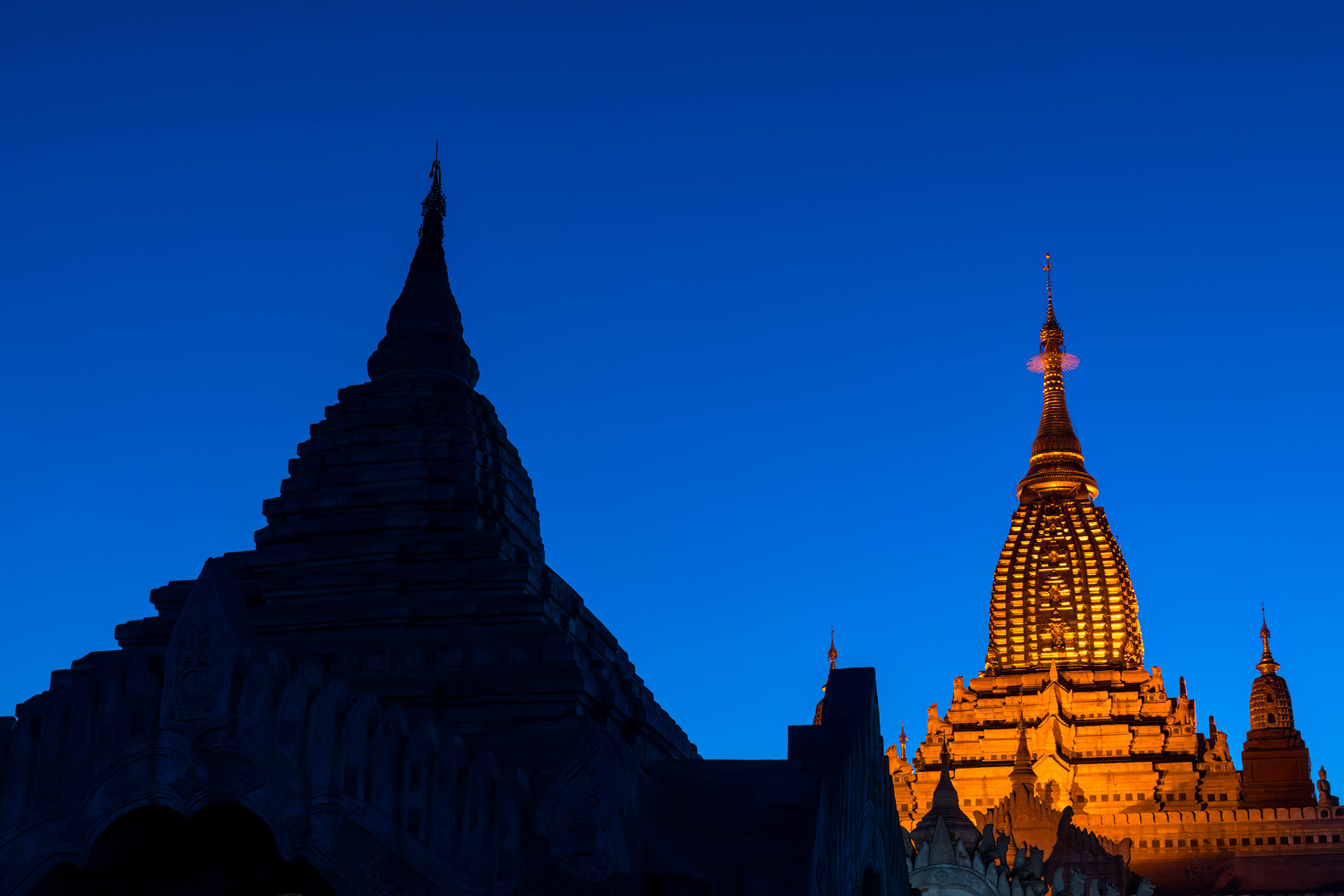 As twilight descends upon the ancient land of Bagan, Myanmar, Ananda Temple emerges as a radiant gem. Its illuminated façade...