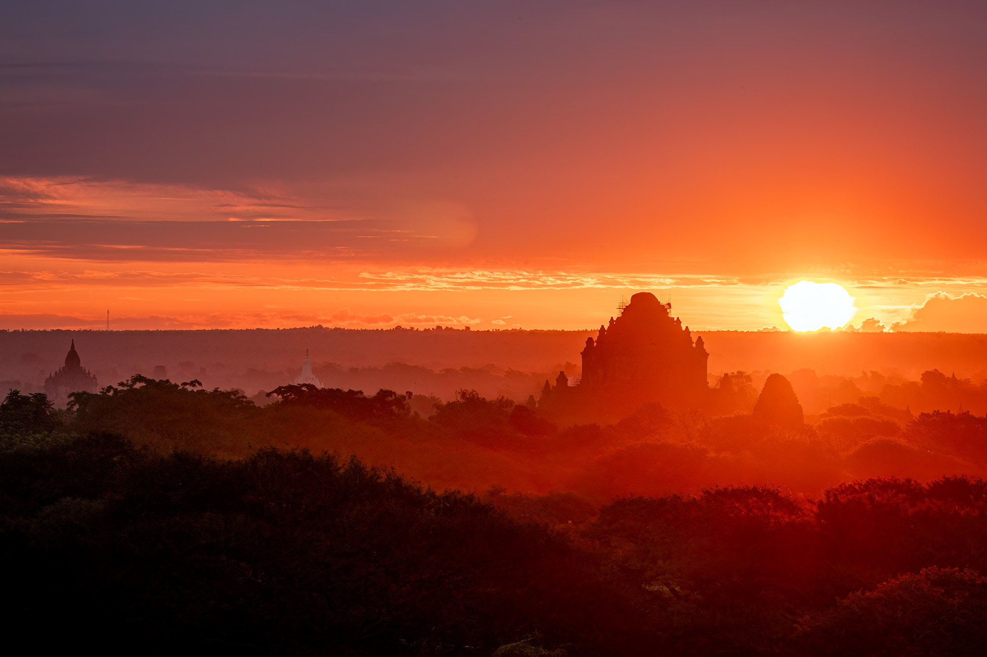 "Fiery Horizon" captures a mesmerizing Bagan sunset, where nature paints the sky in vivid shades of orange and yellow. The silhouettes...