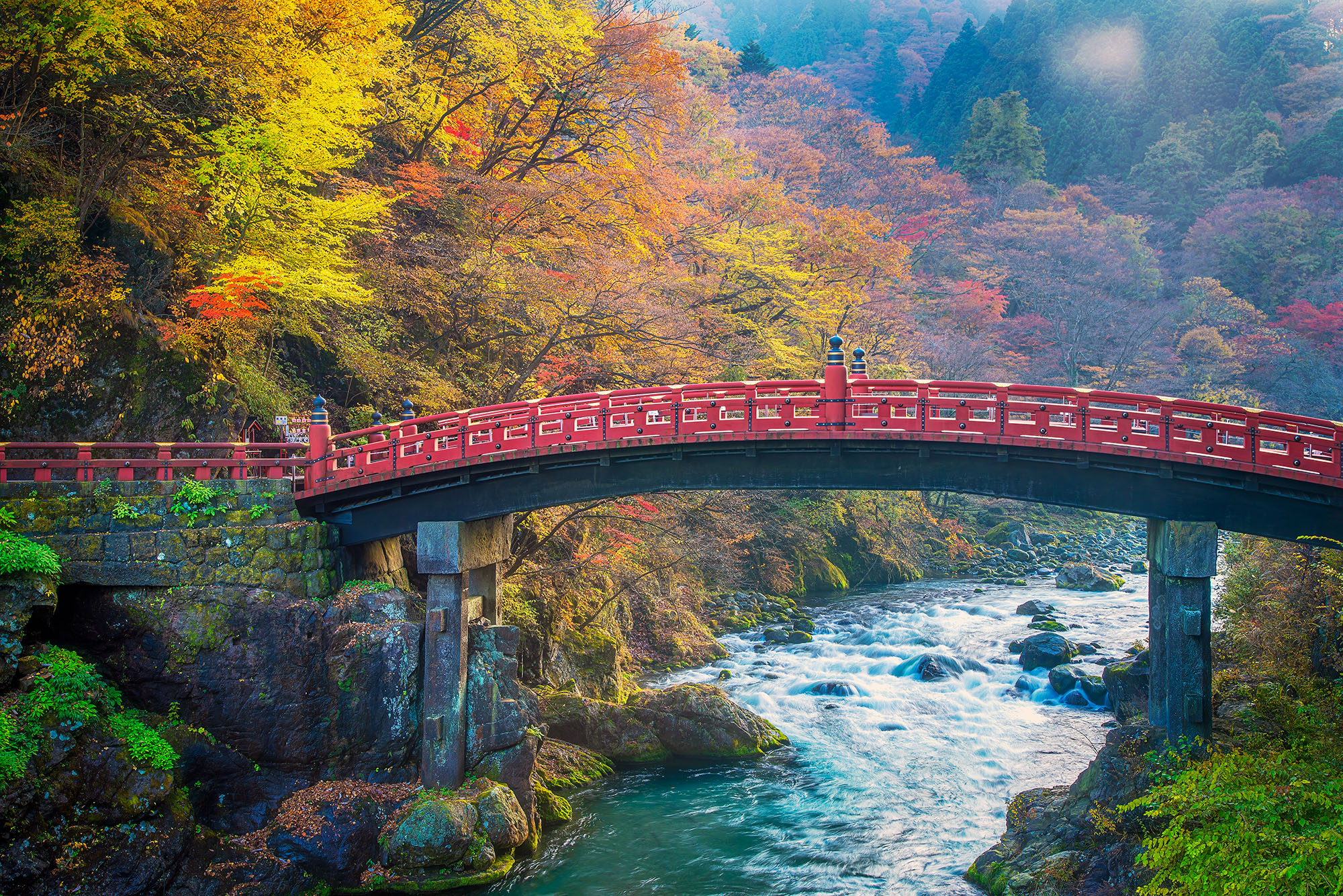 Autumn Splendor at Shinkyo Bridge Captured during the height of autumn's brilliance in Nikko, Japan, this image showcases the resplendent Shinkyo Bridge. Spanning...