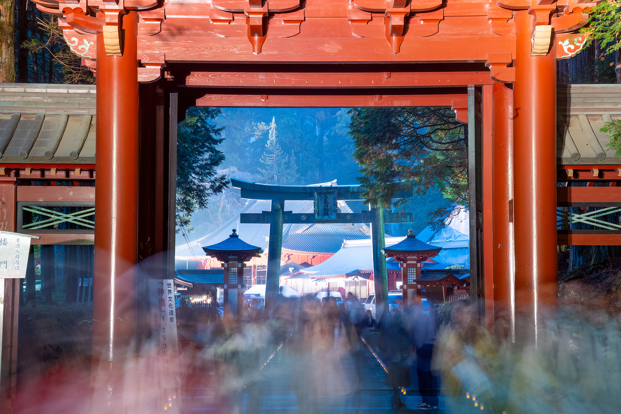Amidst the bustling excitement of one of Nikko's enchanting evenings when the temples are bathed in light, this image captures...