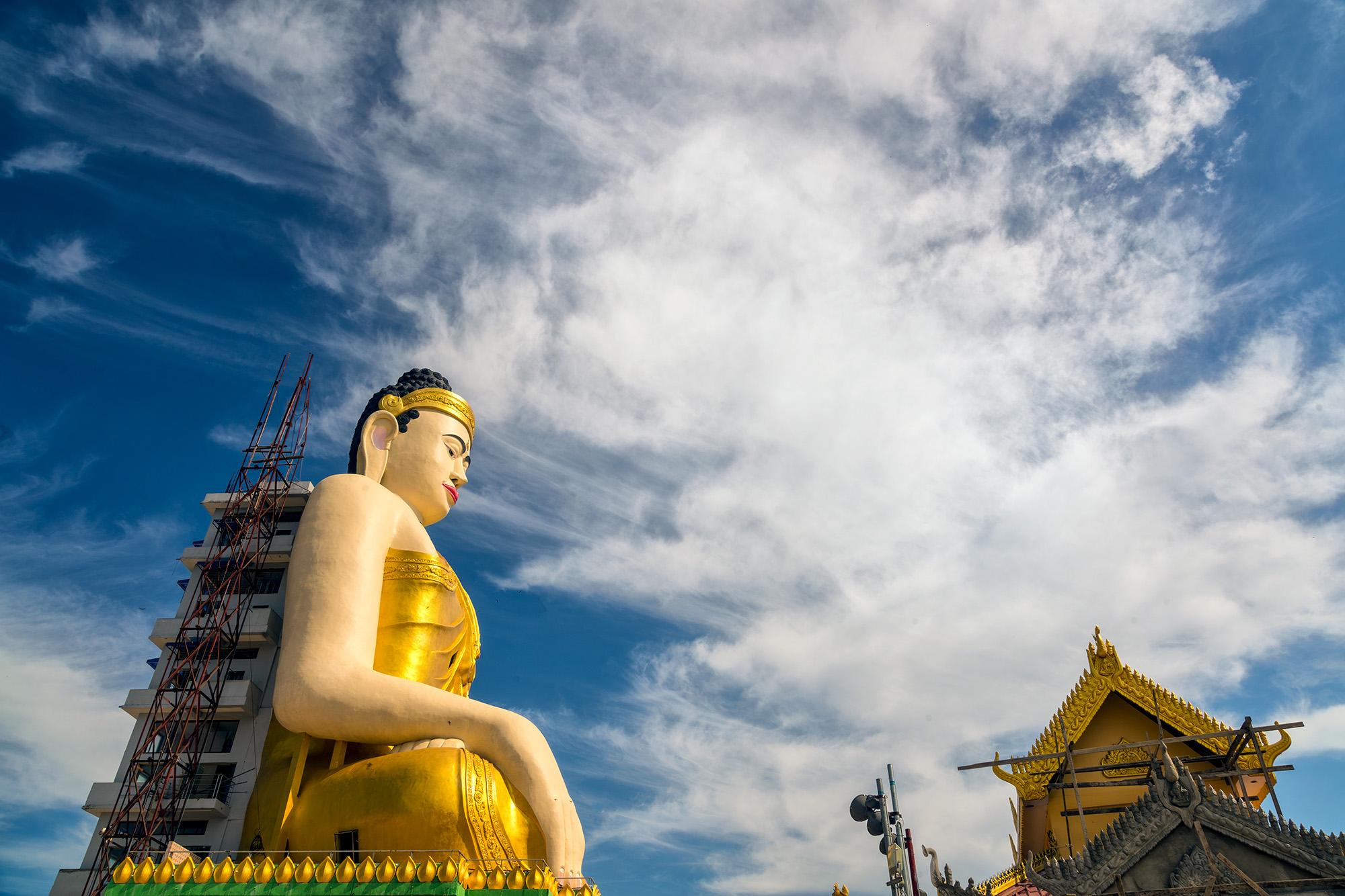 Unfinished Buddha Tower "Unfinished Buddha Tower" reveals an intriguing sight on the road to Mawlyamine. This multi-story Buddha statue, still in construction...