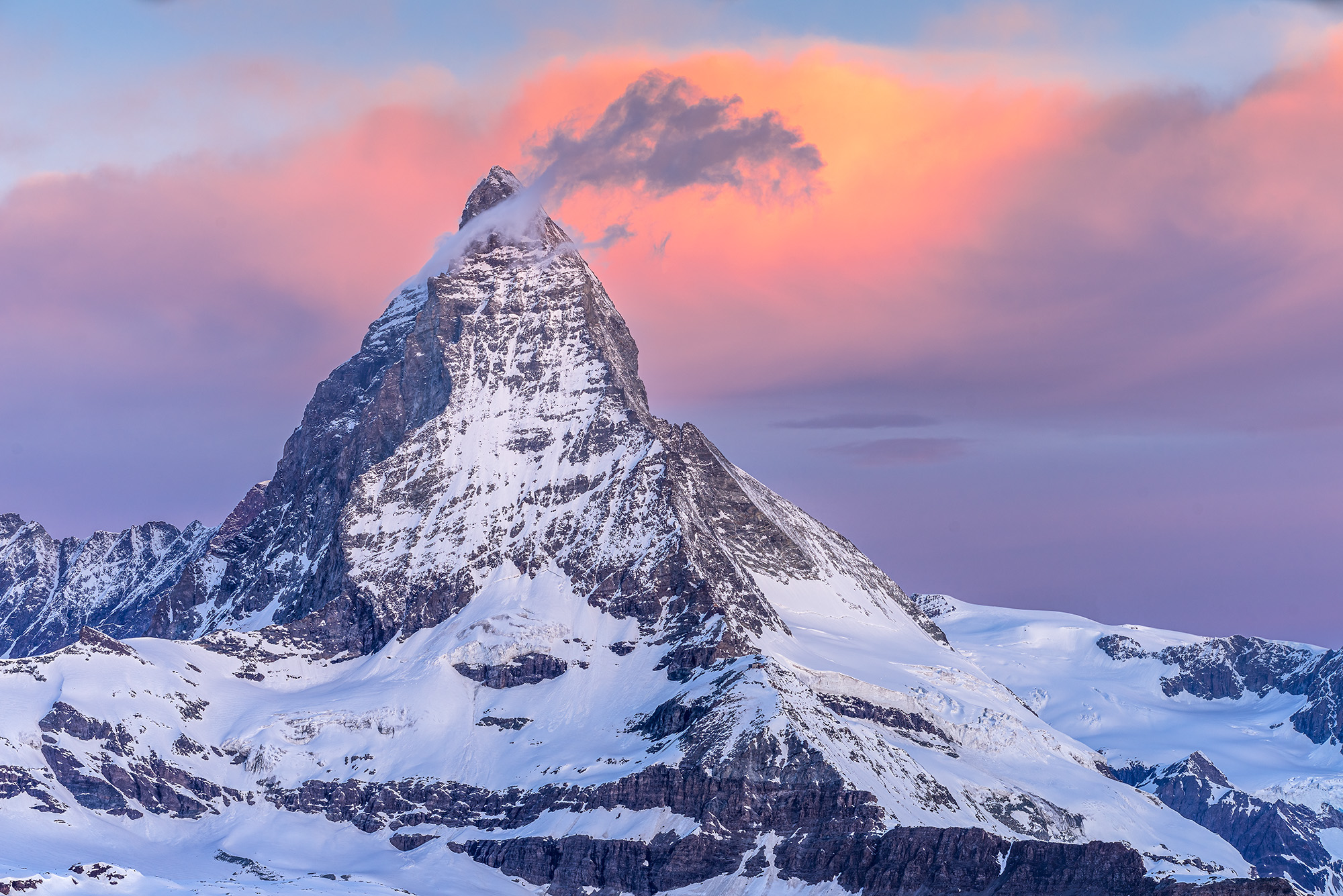 In "Dawn's Embrace of the Matterhorn," the iconic Swiss peak is unveiled in all its glory. As the first light of sunrise graces...