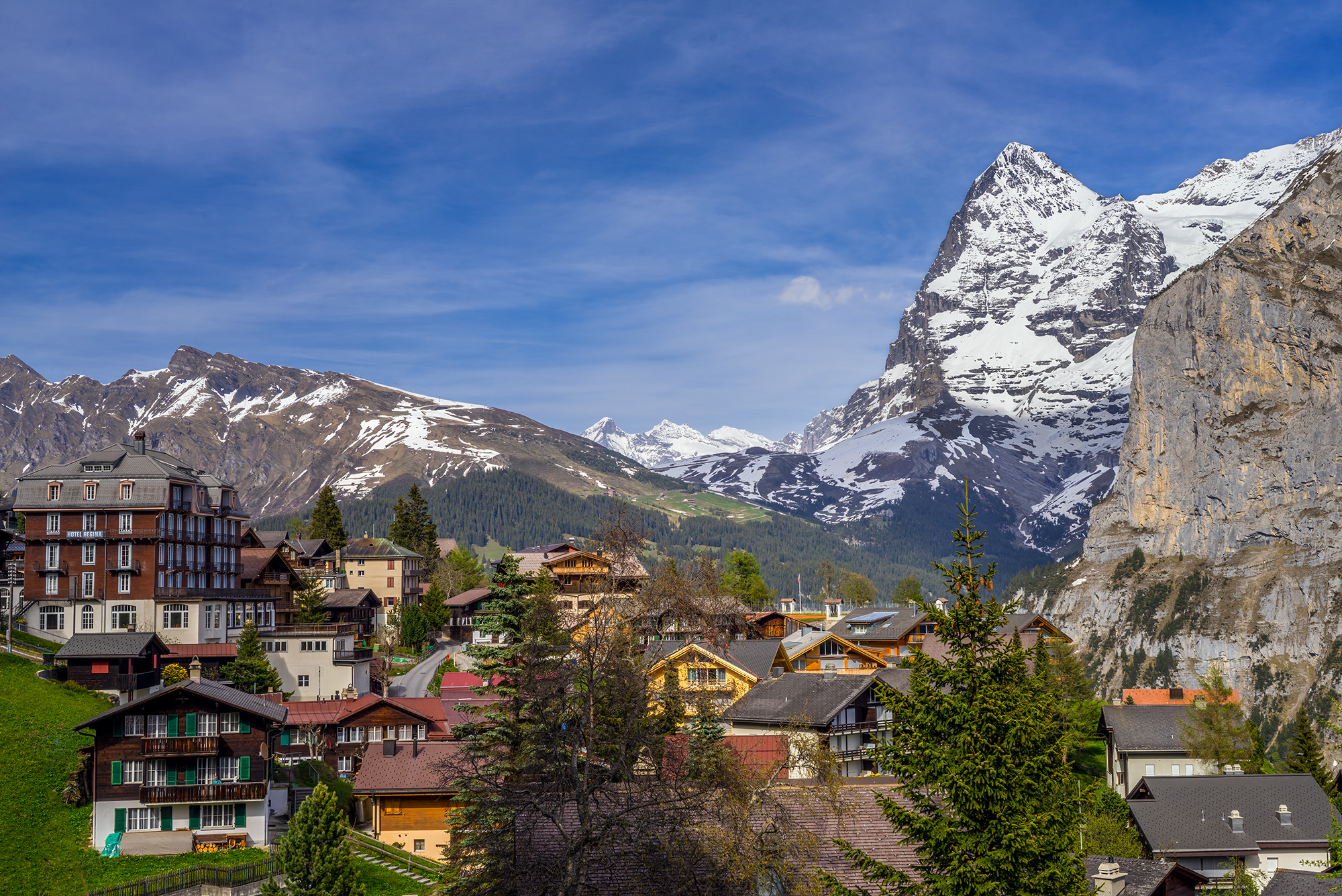 In "Mürren's Alpine Ascent," I capture the essence of a crisp morning in the charming Swiss village of Mürren. The Eiger mountain...