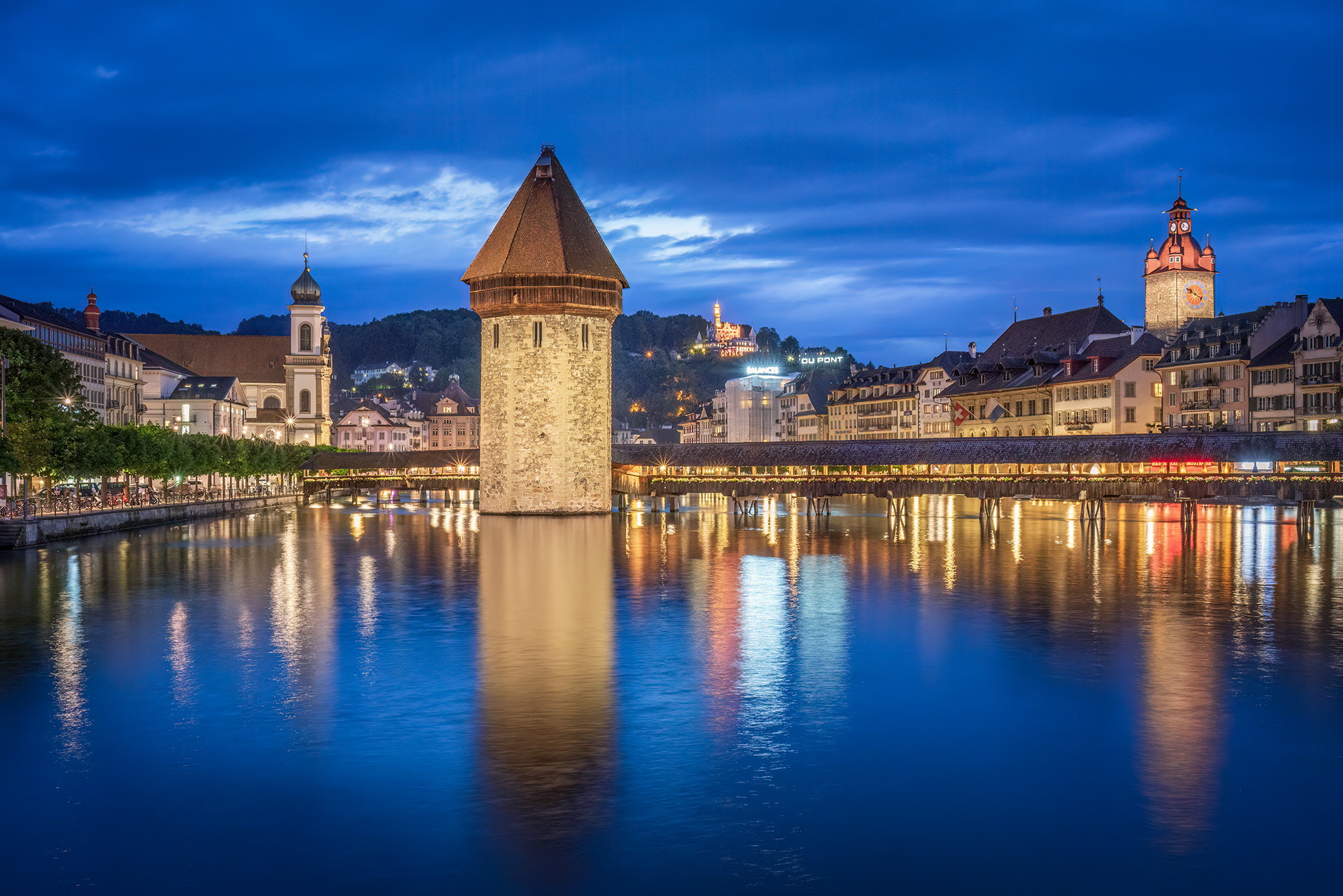 In "Lucerne's Timeless Link," I capture the charm of Lucerne, Switzerland, during the enchanting blue hour. This expansive view...