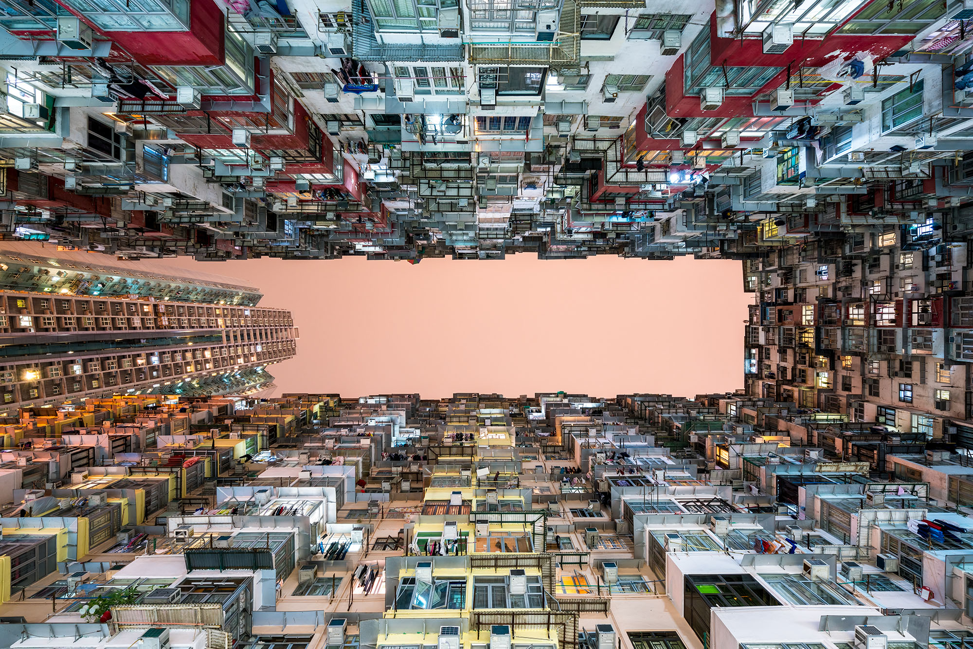 This striking image captures the Yick Cheong Building in Hong Kong against the backdrop of the night sky. This architectural...