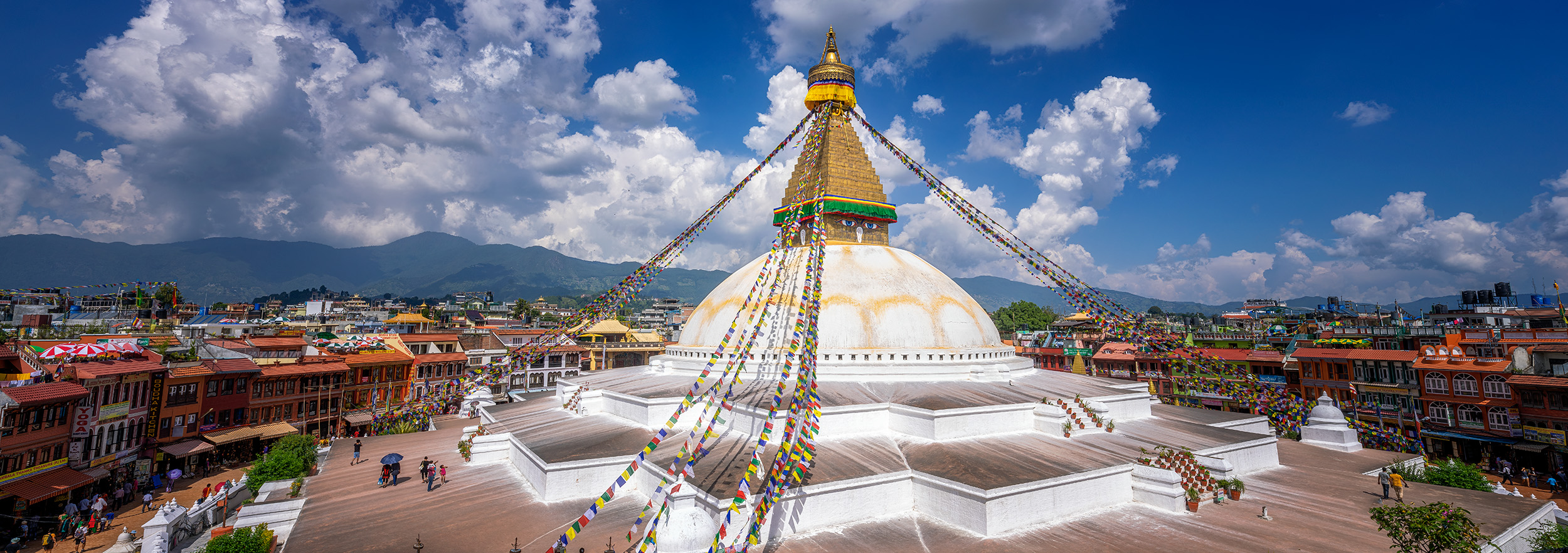 "Bouddhanath Unveiled" offers a sweeping 6x17 panoramic view of Kathmandu's Bouddhanath Temple and its vibrant surroundings....