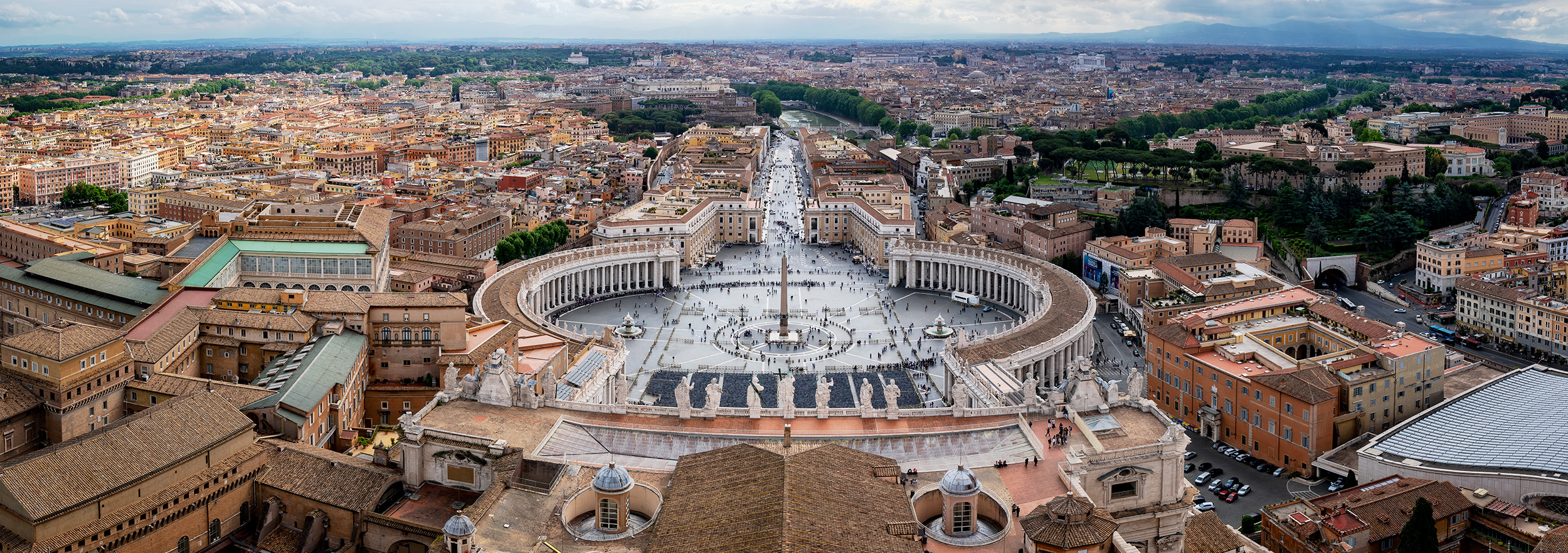 Front of St Peters Basilica Panoramic To capture this panoramic image of the grounds in front of St. Peter's Basilica, one must navigate through a labyrinth of passageways...