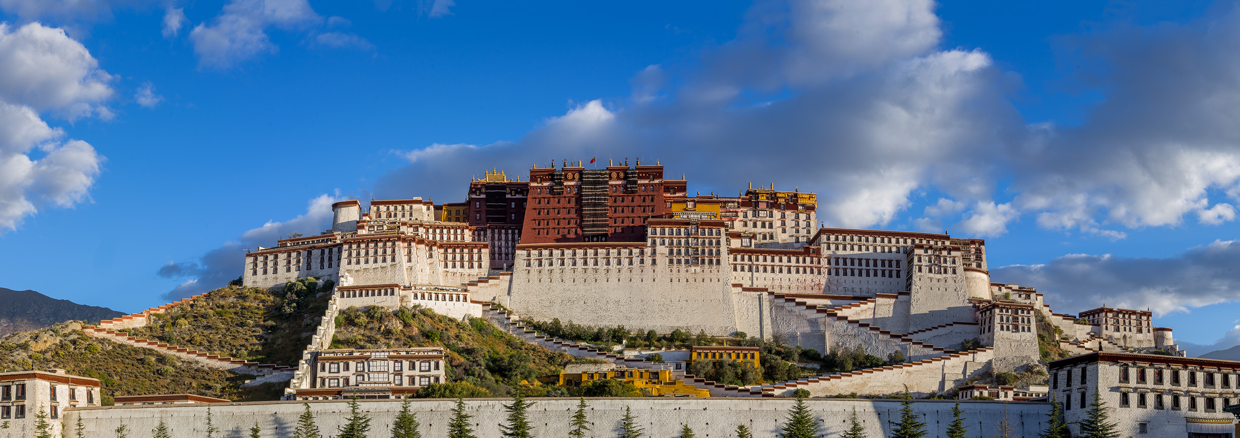 This panoramic image, captured from the iconic Potala Palace in Lhasa, Tibet, offers an unobstructed view of this architectural...