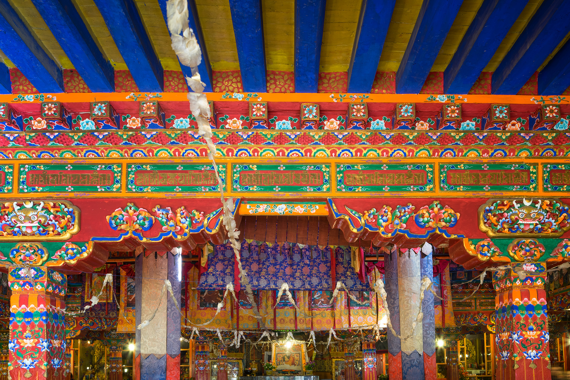 Within the sacred walls of the Drepung Monastery in Lhasa, Tibet, this photograph captures a riot of colors and intricate details...