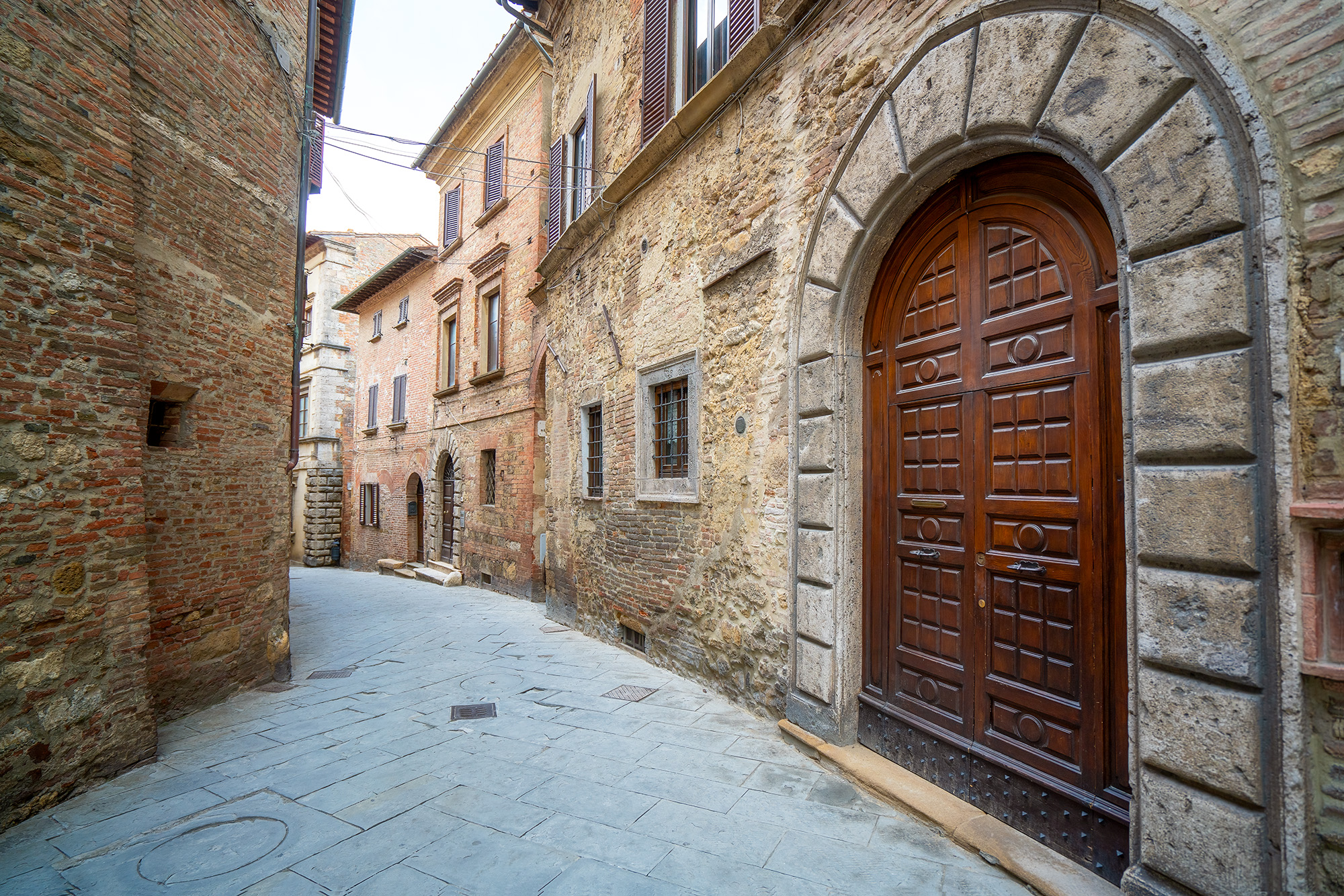 In the heart of Montepulciano, Tuscany, Italy, this photograph captures the essence of village charm. Taken with a wide-angle...