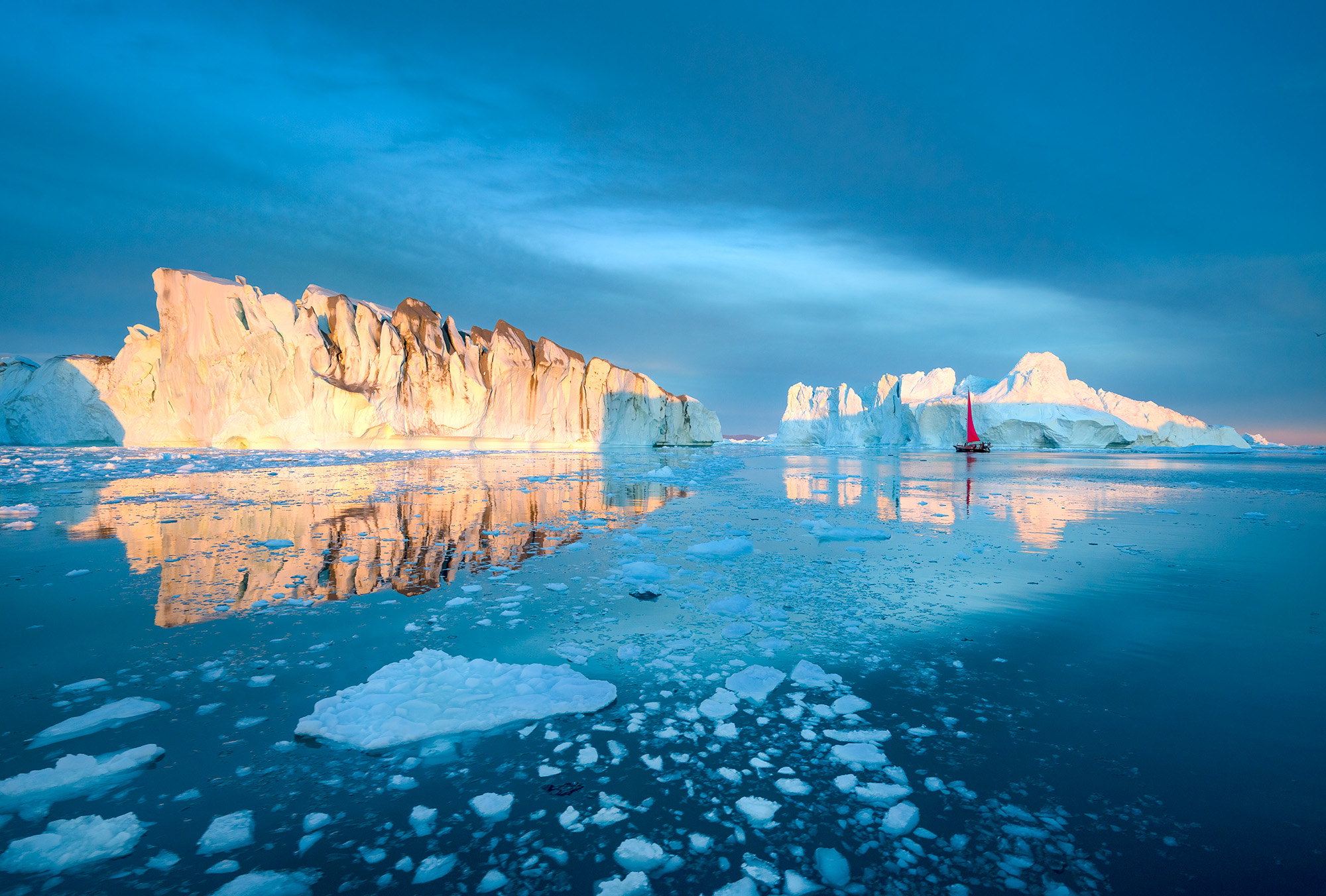 Set in Disko Bay near Ilulissat, Greenland, this image captures the captivating allure of the Arctic landscape. In the distance...