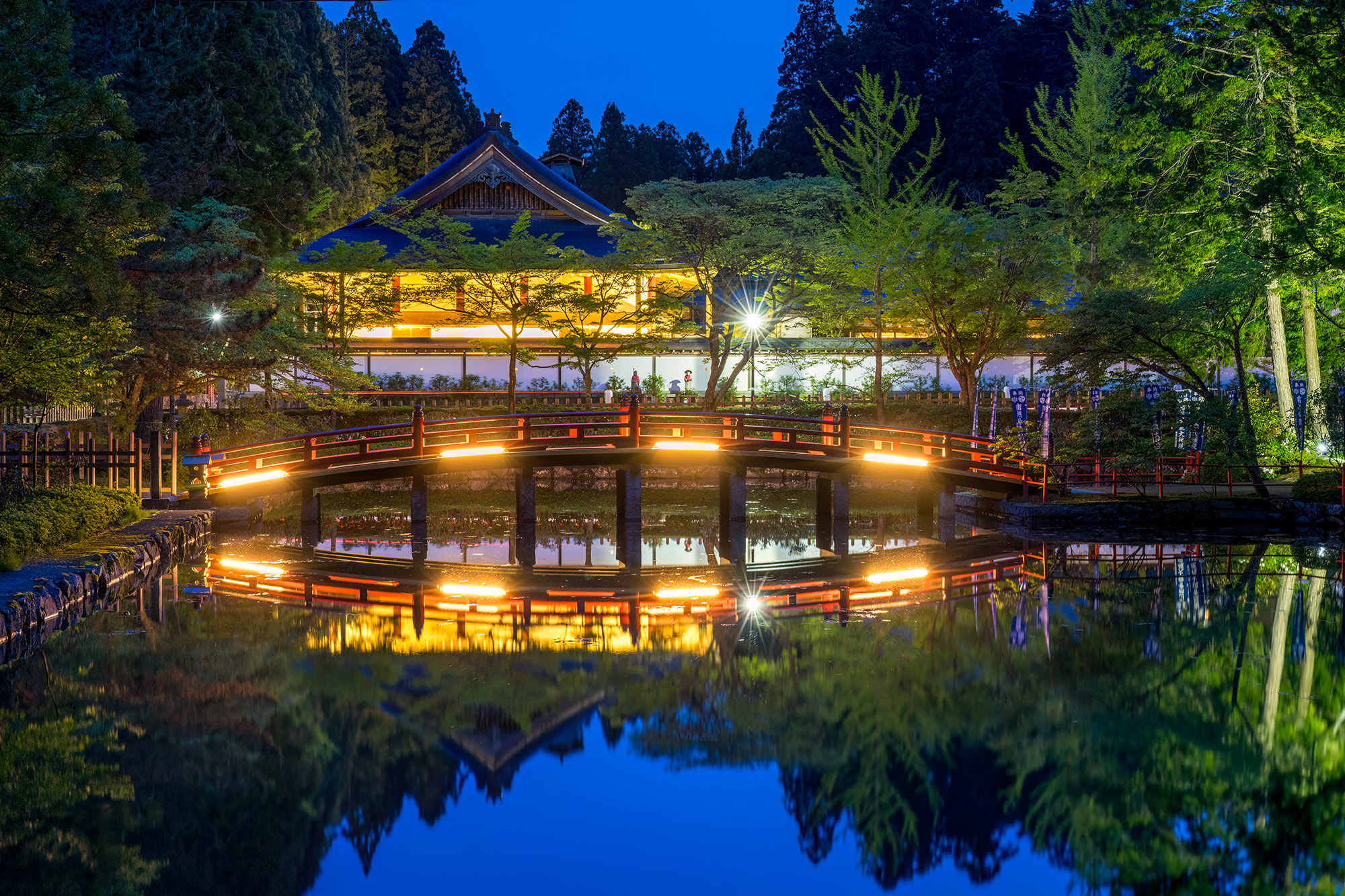 Twilight Reflections: Koyasan Bridge and Temple Amidst the enchanting twilight of Koyasan, Japan, the serenity of the moment is captured in this exquisite image. The bridge...