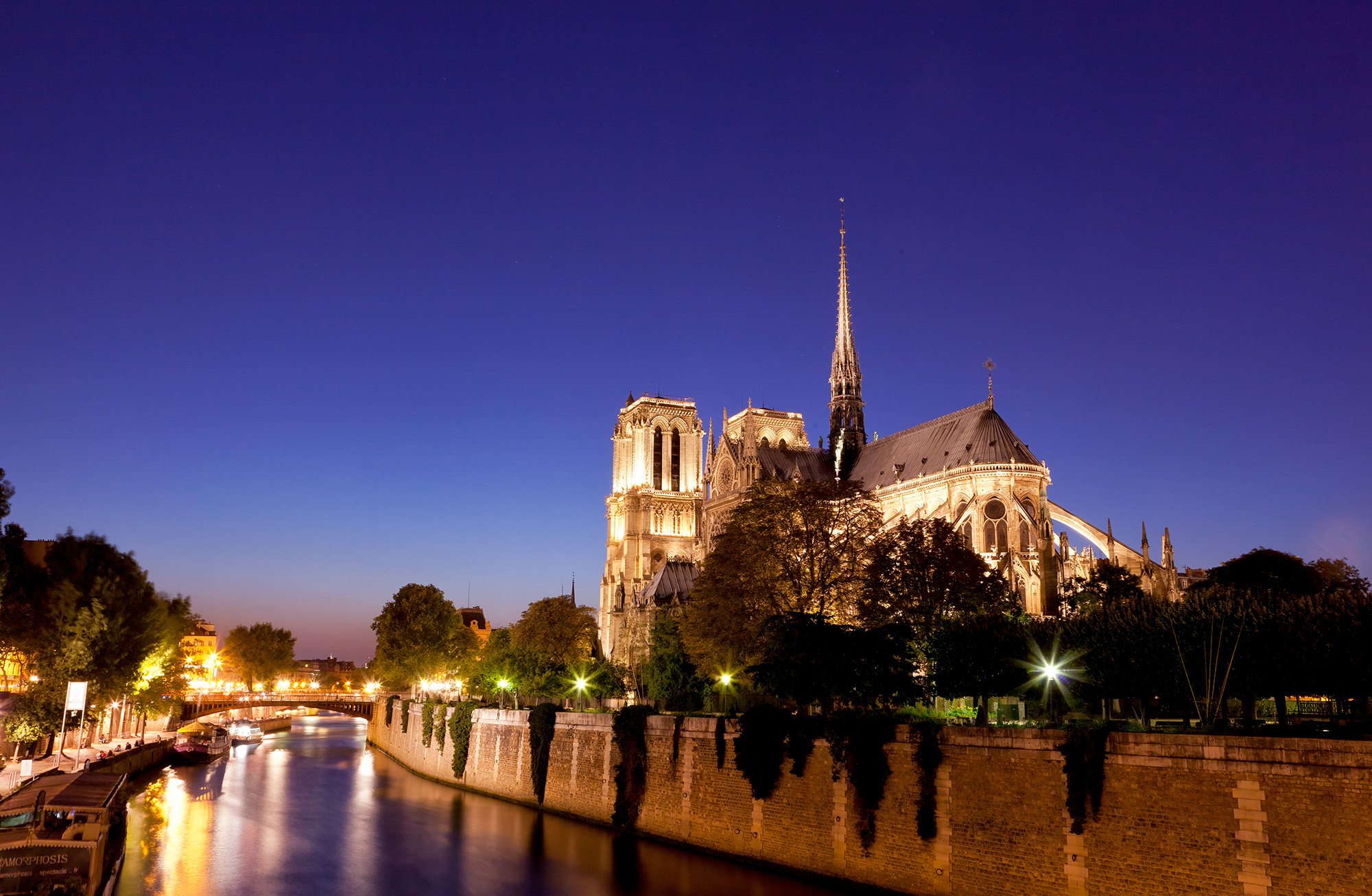 "Notre Dame Illumination" captures the iconic Notre Dame Cathedral in the enchanting blue hour. Taken from across the Seine River...