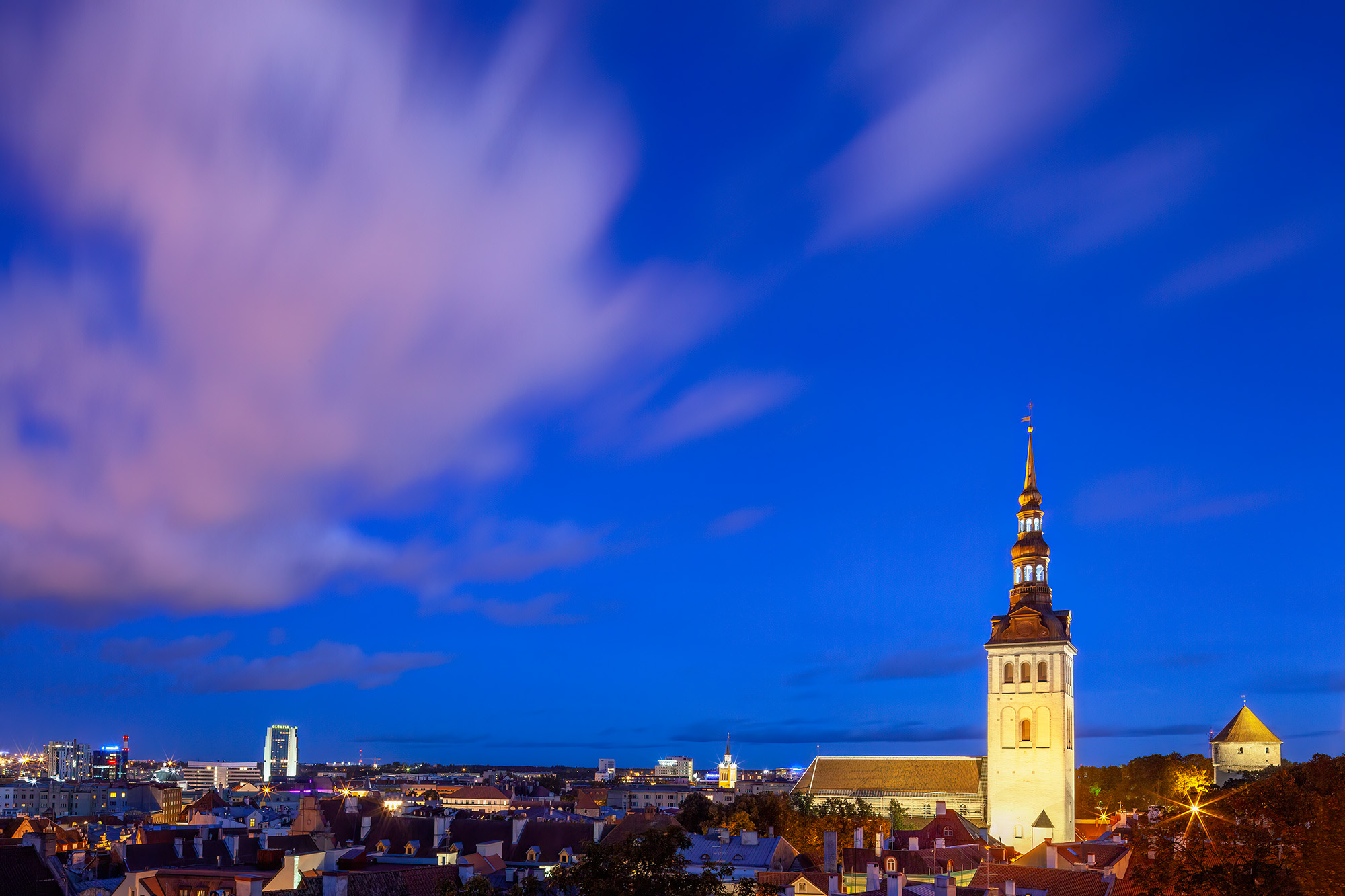 This enchanting horizontal image captures the beauty of Tallinn, Estonia, during the serene blue hour. St. Olaf's Church stands...
