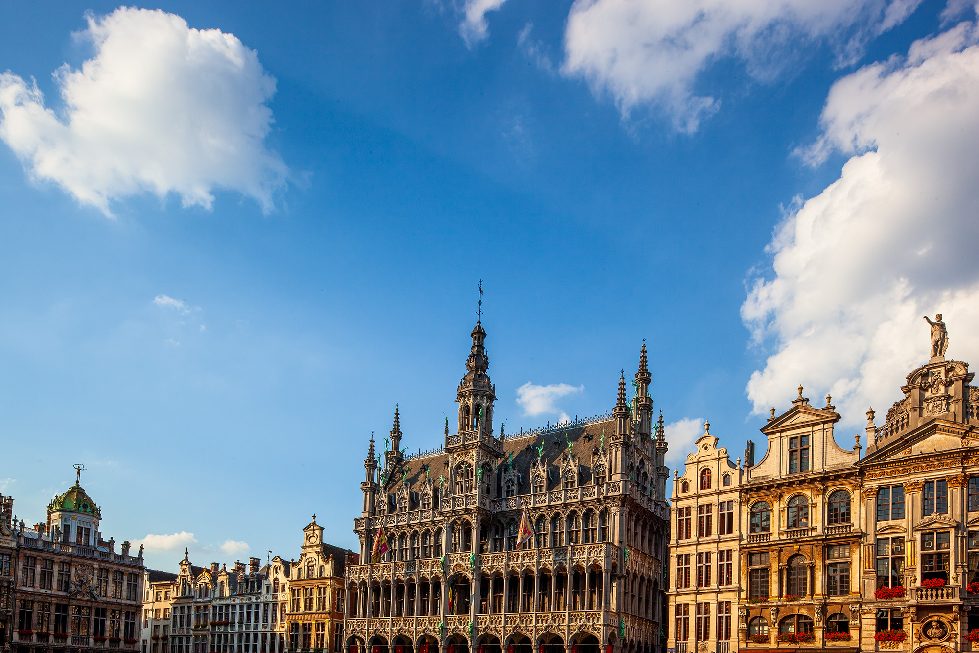 "Brussels Elegance: Grand Place Illumination" captures the architectural splendor of Grand Place in Brussels, Belgium. Sunlight...