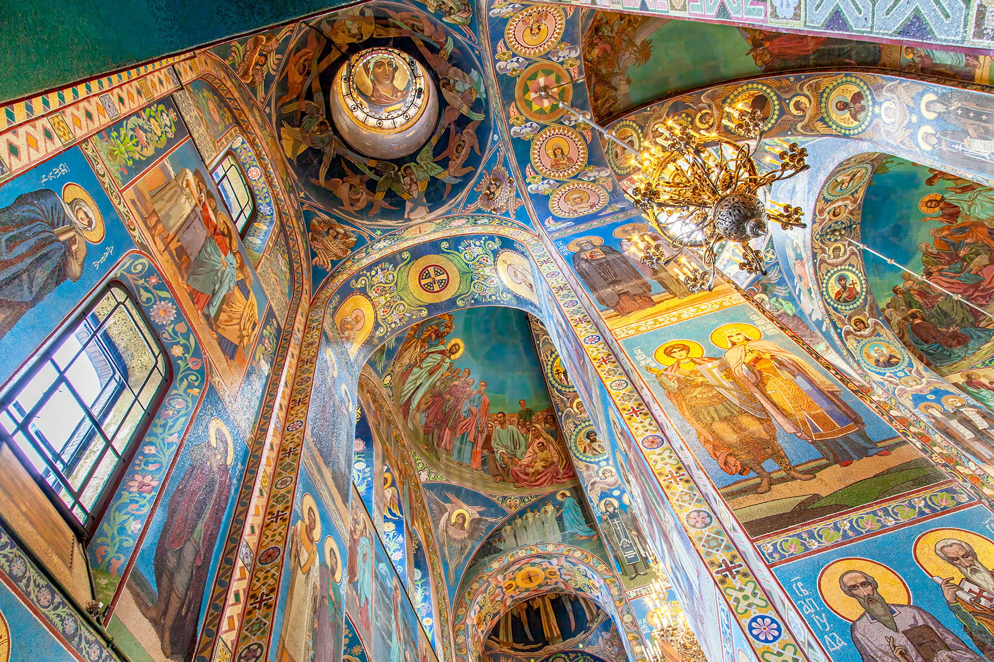 Inside the Church of the Savior on Spilled Blood in St. Petersburg, Russia, my gaze is drawn upward to a breathtaking sight....