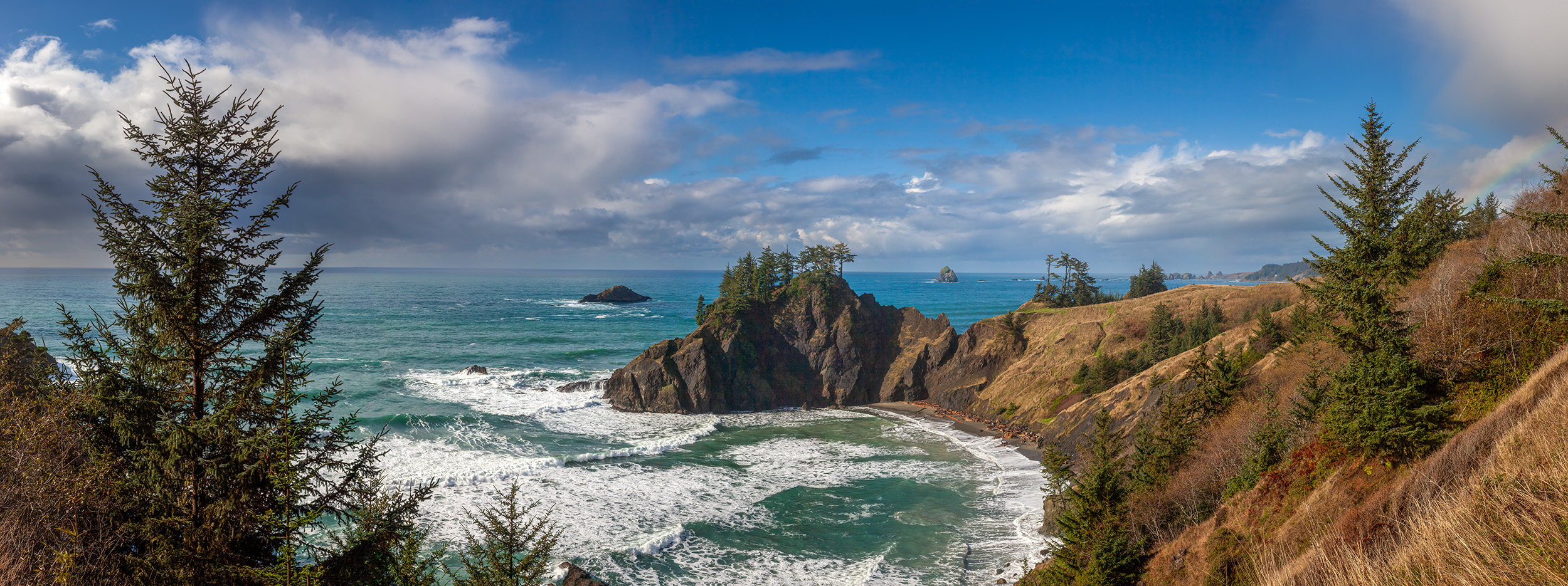 Coastal Beauty in Panorama This panoramic image, captured along the Oregon coast, invites you to explore its inviting charm. At the center stands a captivating...