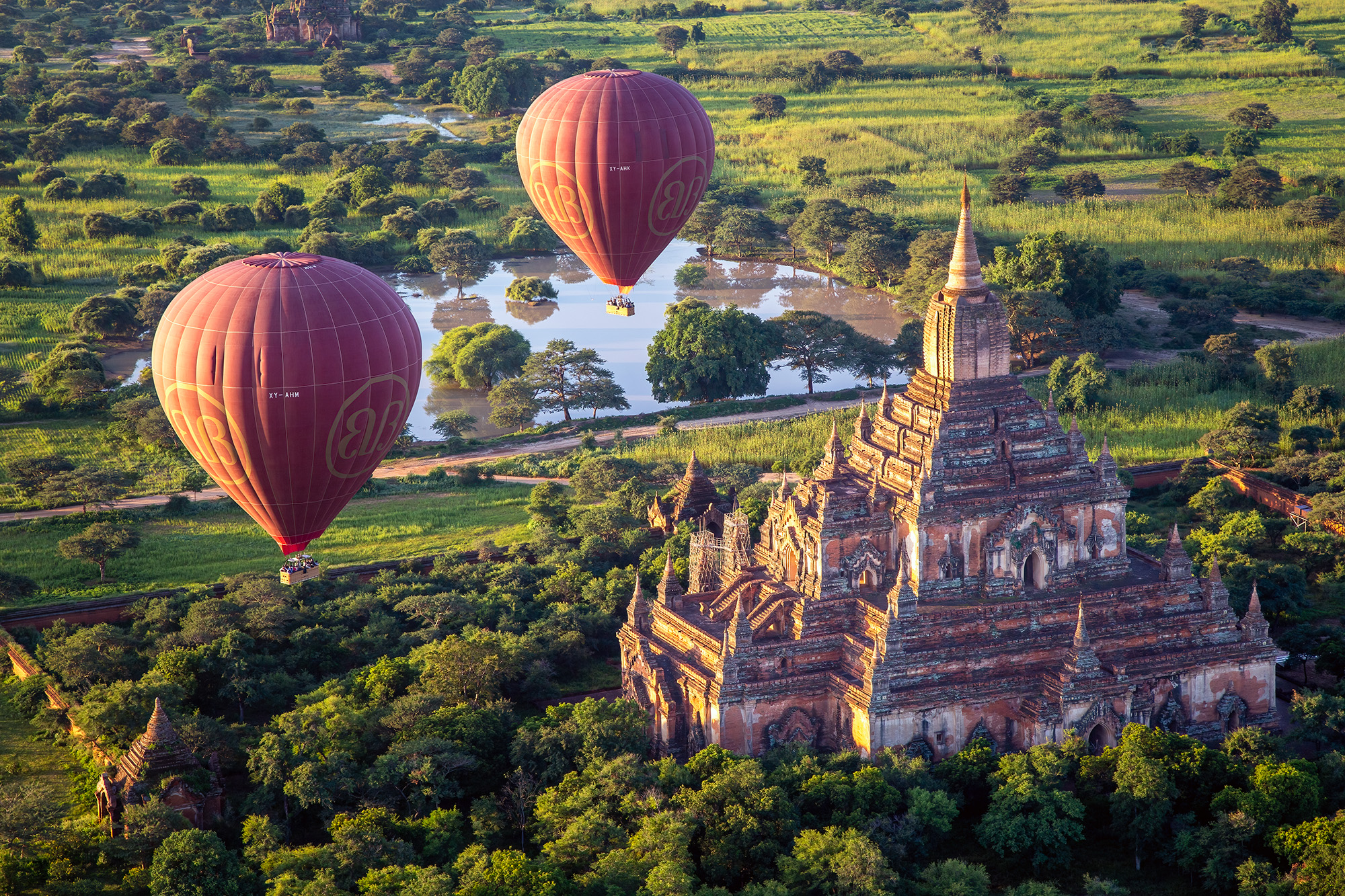 Bagan's Majestic Heights Captured from a hot air balloon drifting gracefully over the enchanting temples of Bagan, Myanmar, this image offers a closer...