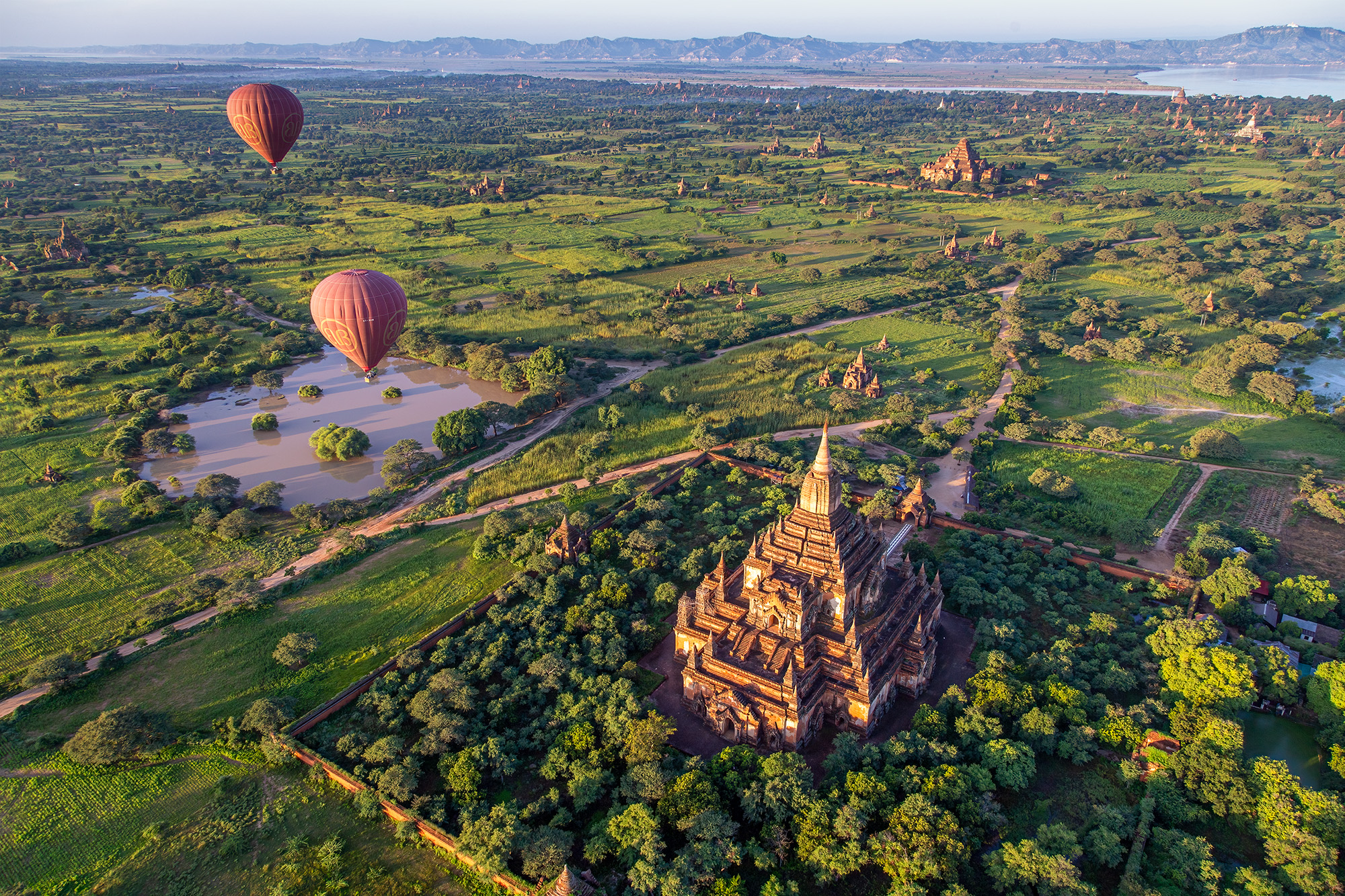 Majestic Bagan from Above Captured from a hot air balloon gracefully gliding over Bagan, Myanmar, this aerial view reveals the vast expanse of ancient...