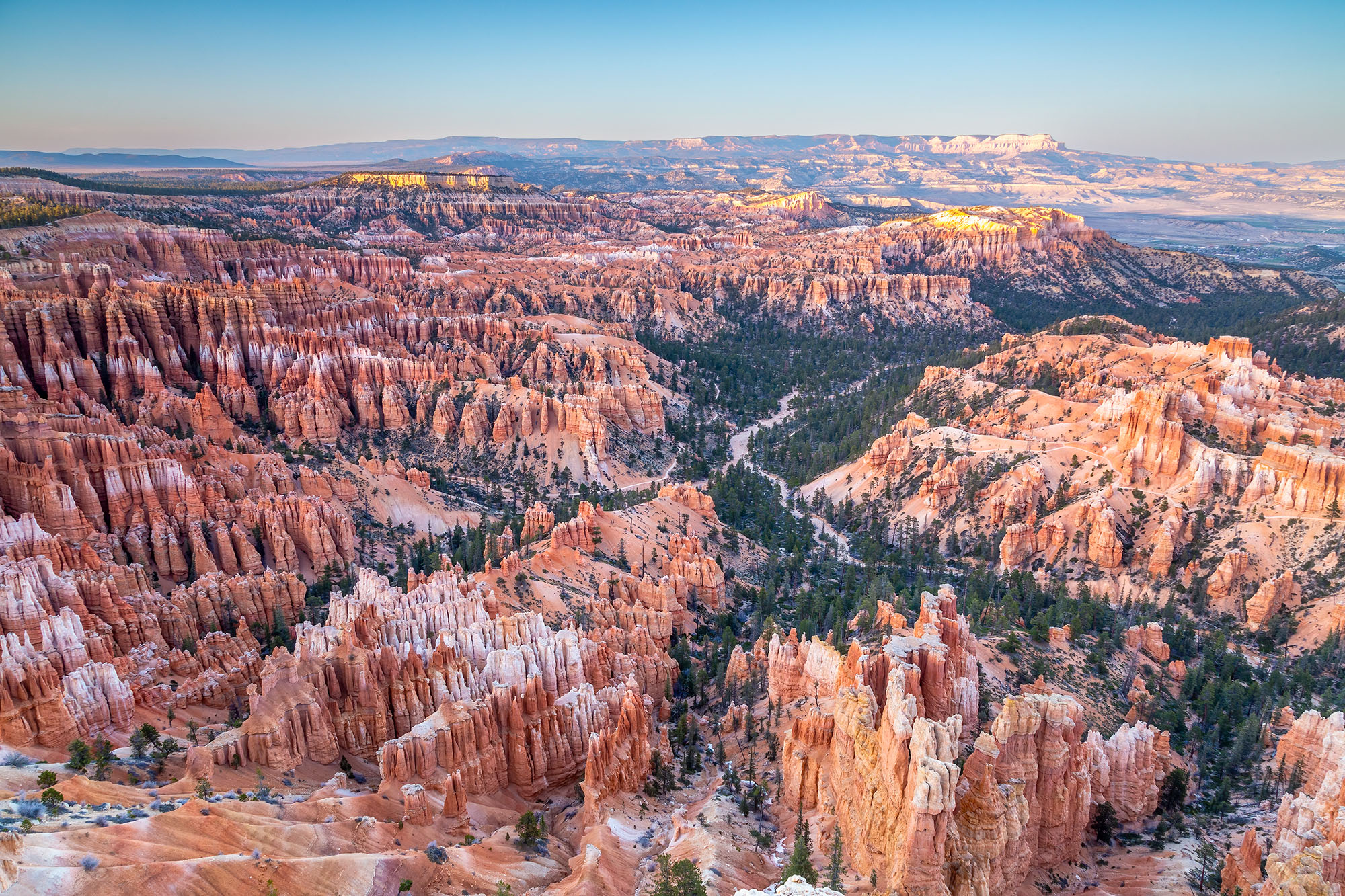 This photograph, captured at Bryce Canyon National Park, Utah, showcases the grandeur of the park from Bryce Point Viewpoint....