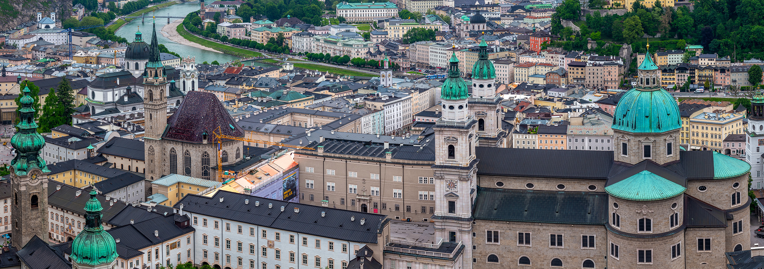 "Salzburg's Rooftop Symphony" presents a mesmerizing stitched panoramic view captured from the vantage point of the castle, offering...