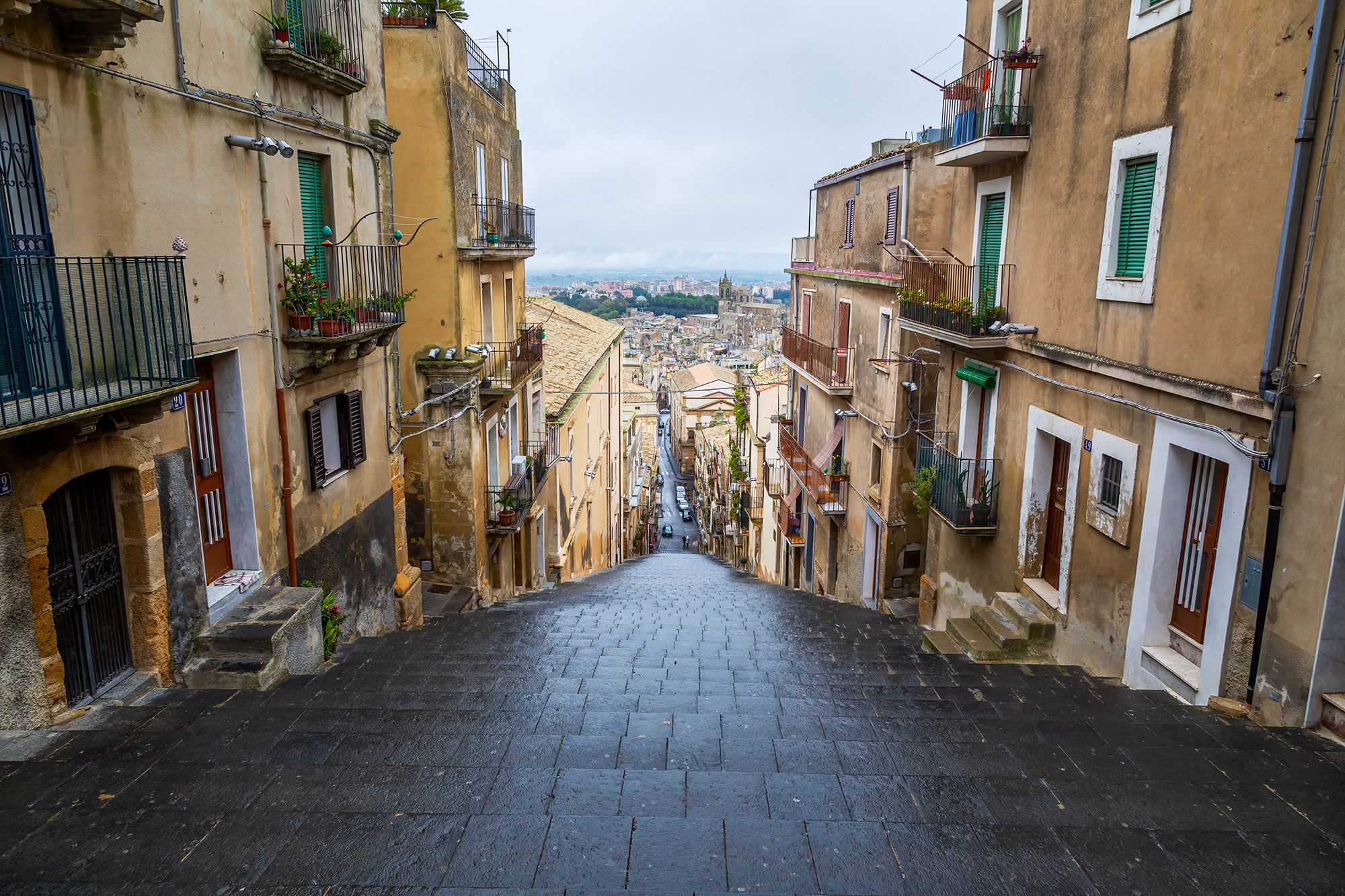 This photograph, taken in the picturesque town of Caltagirone, Sicily, Italy, offers a captivating perspective. From a high vantage...