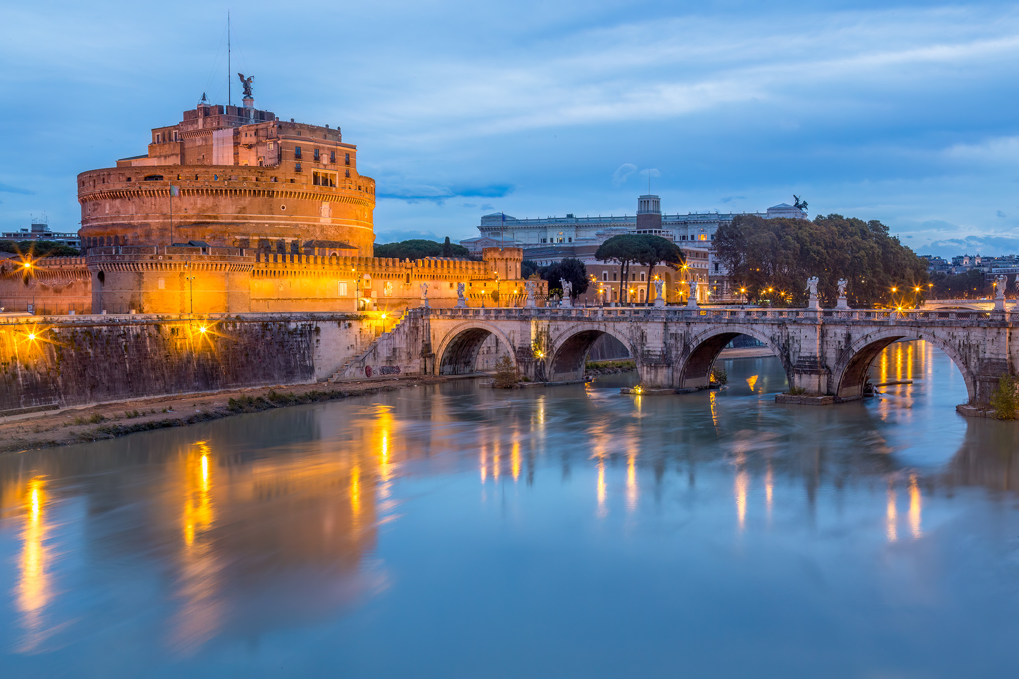 Castel Sant'Angelo at Bluehour On a chilly late November night, I set out to Castel Sant'Angelo during the serene blue hour to capture this image. The water...
