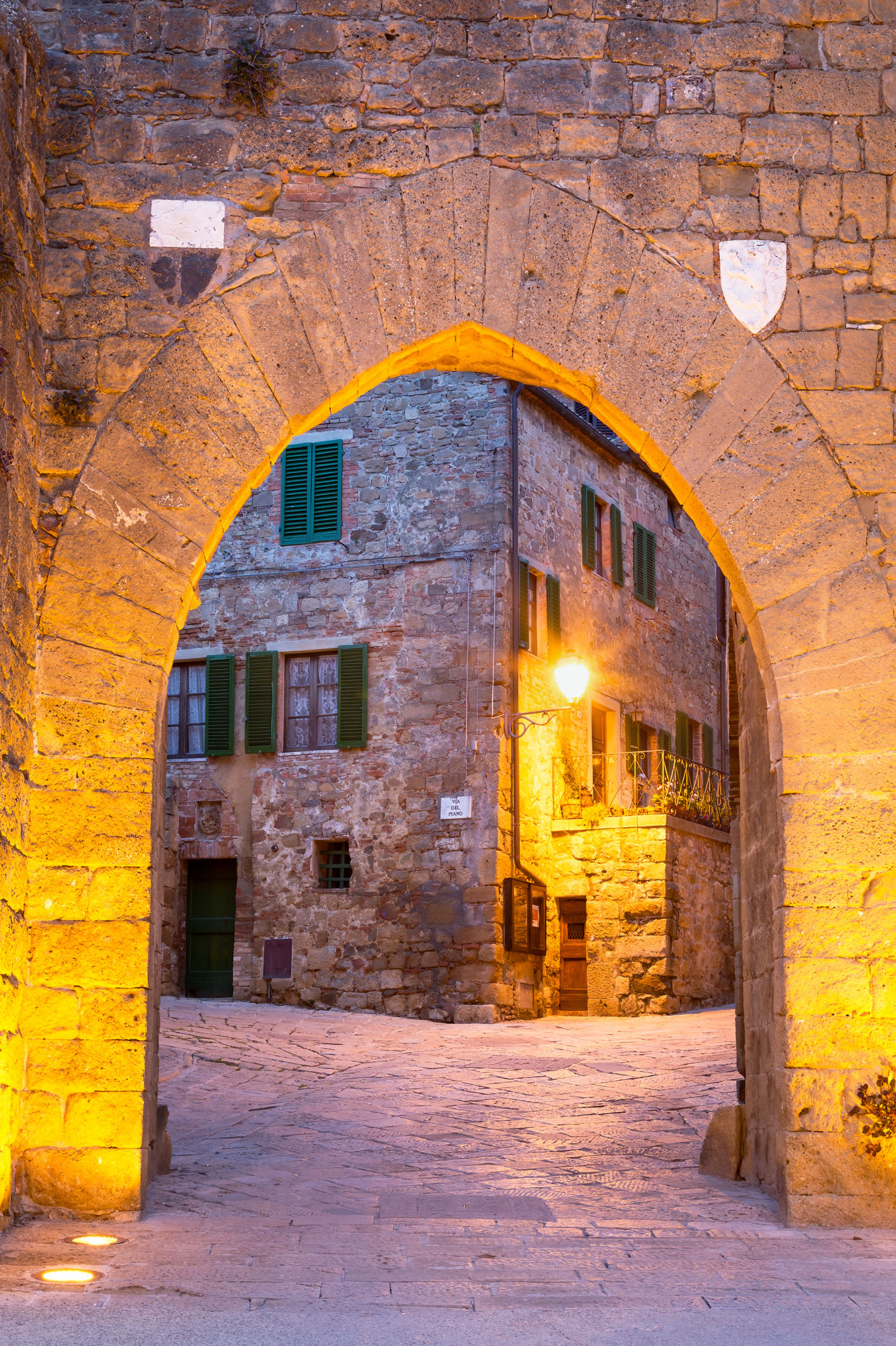 At the entrance to Monticchiello, Tuscany, Italy, I captured a scene that felt like stepping into a storybook. An arched stone...