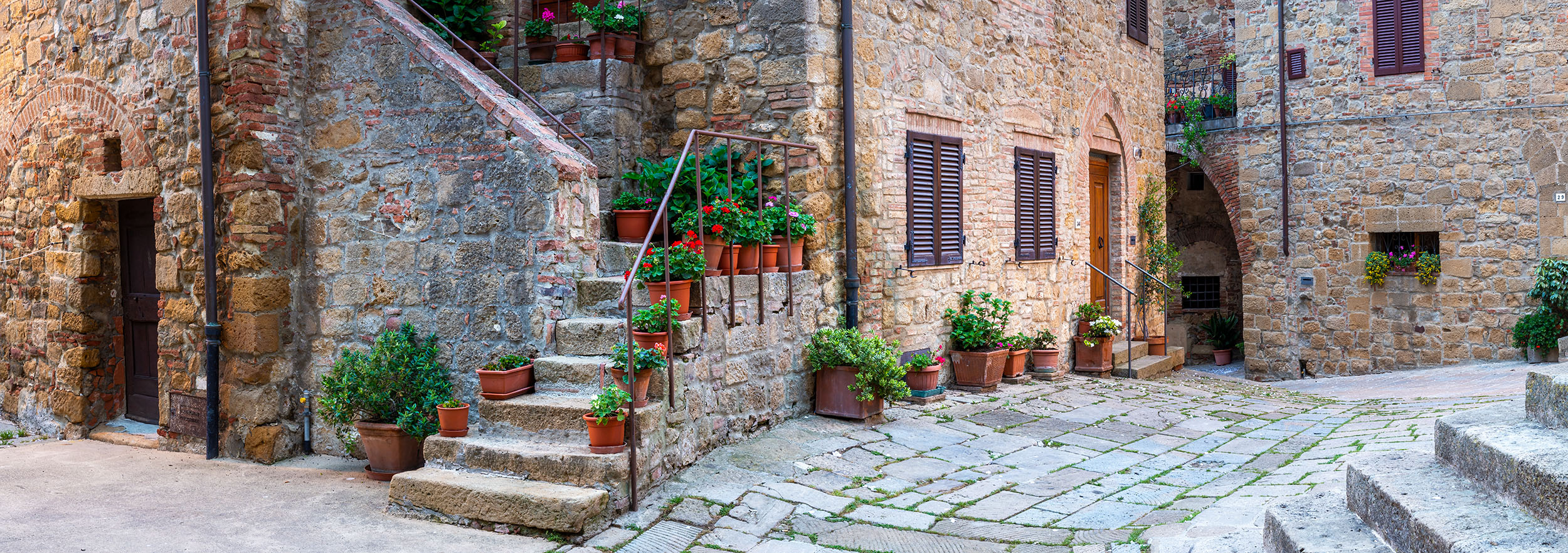 Monticchiello's Medieval Passage My lens captured a cross-section of Monticchiello, Tuscany, Italy, in this panoramic mosaic. At its heart, a stone staircase...