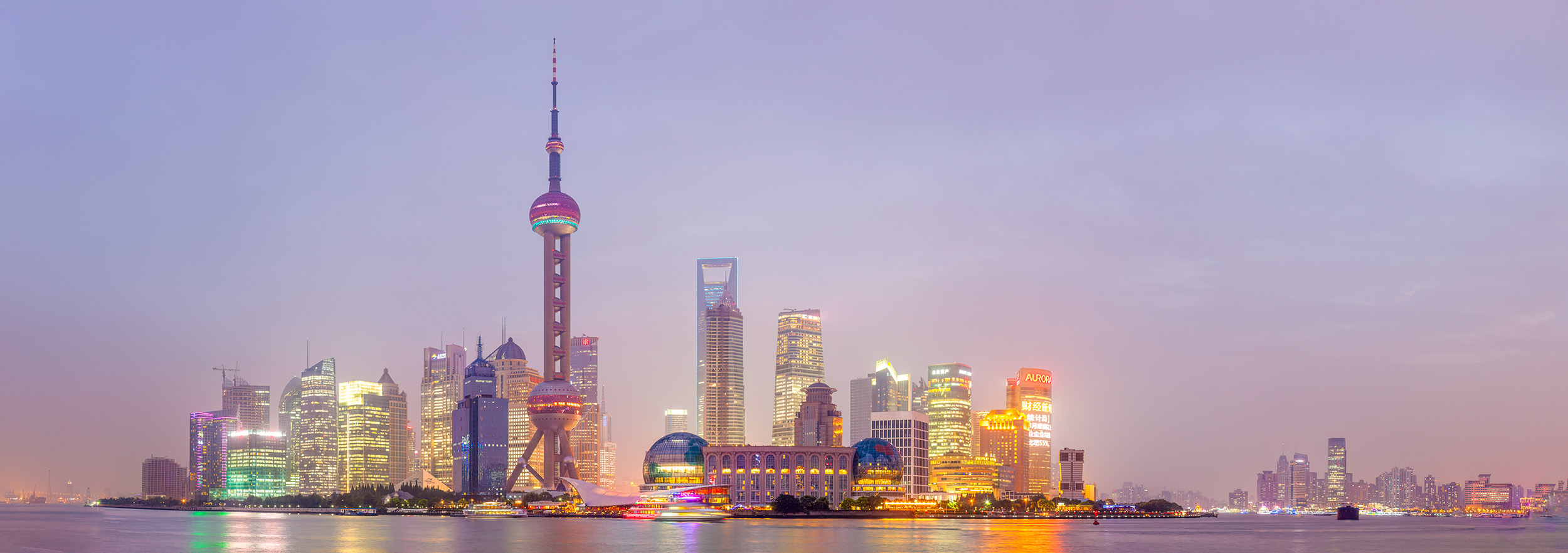 This panoramic image was taken from the iconic Bund side of Shanghai, gazing across the water at the Pudong skyline illuminated...