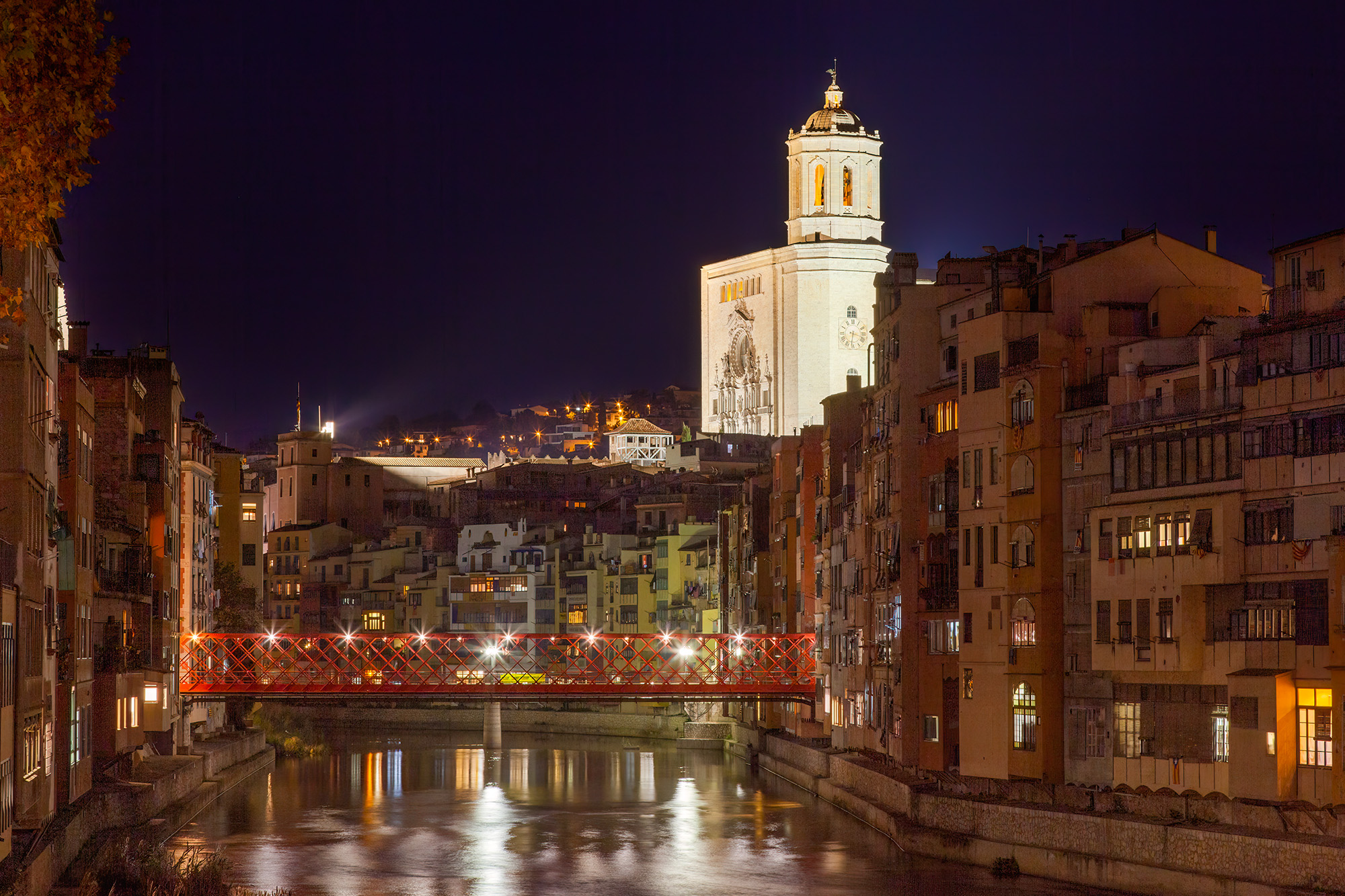 From a bridge in Girona, Spain, I captured a mesmerizing night scene. The illuminated Girona Cathedral, with its intricate fa...