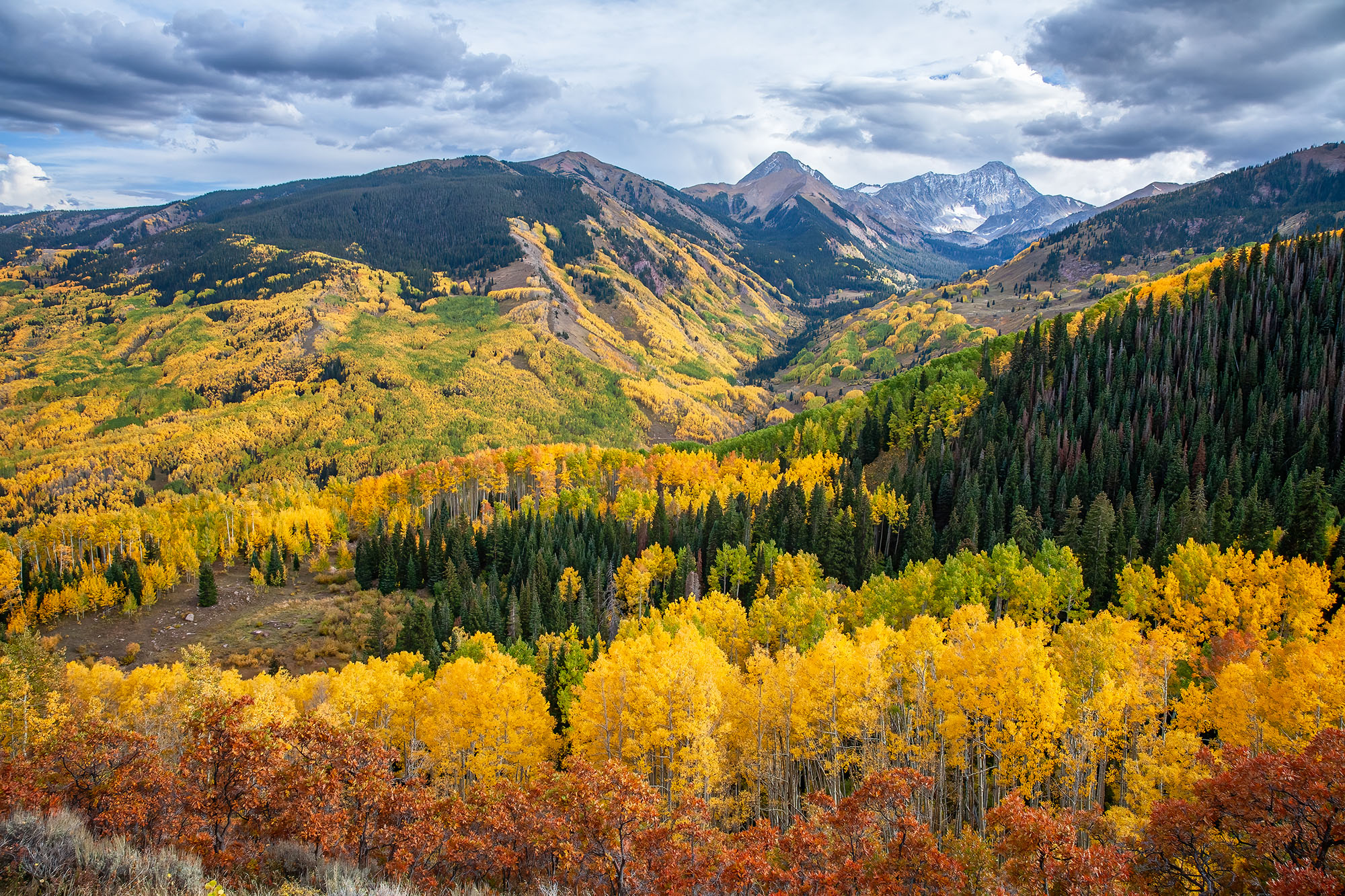 This image, captured during the vibrant fall season in Colorado, unveils the grandeur of Capitol Peak. Amidst a series of valleys...