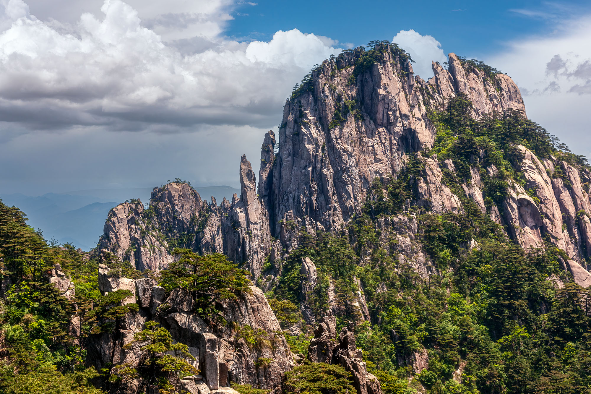In this image from the East Sea Yellow Mountains of Mount Huangshan, China, nature reveals its rugged and untamed beauty. The...