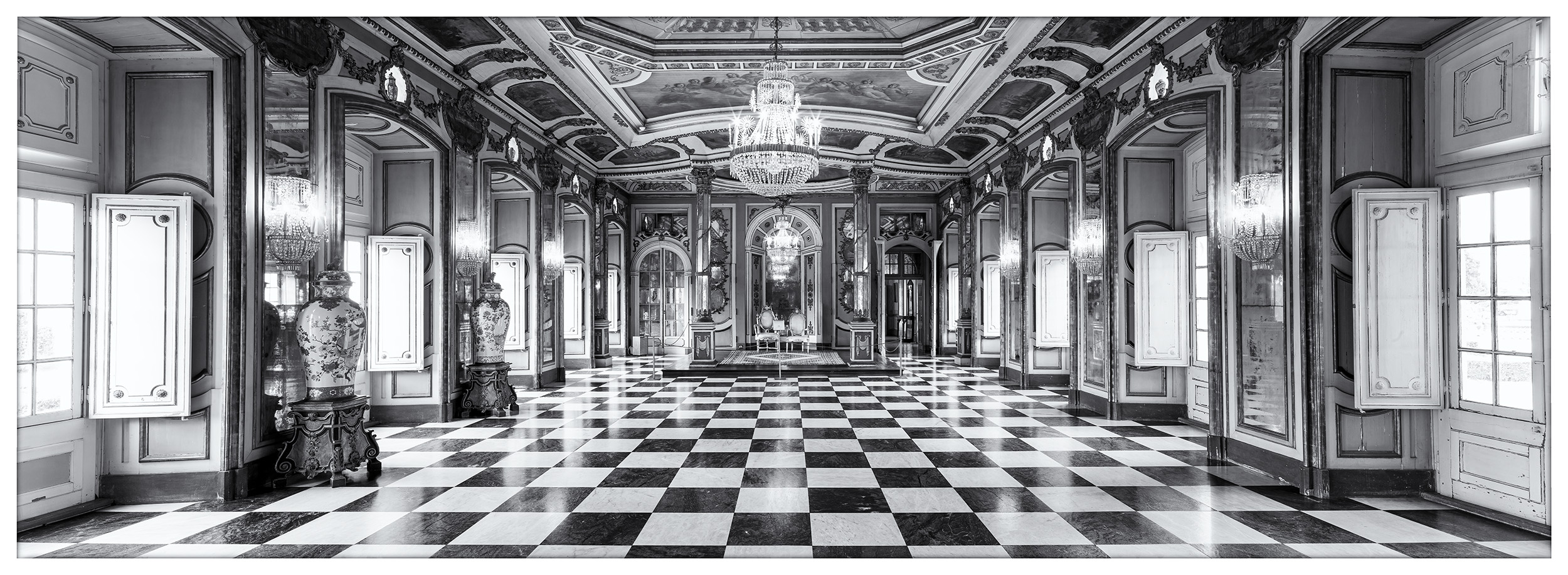 In Lisbon, Portugal, I captured this expansive black and white panoramic image within the Throne Room of Queluz Palace. The most...
