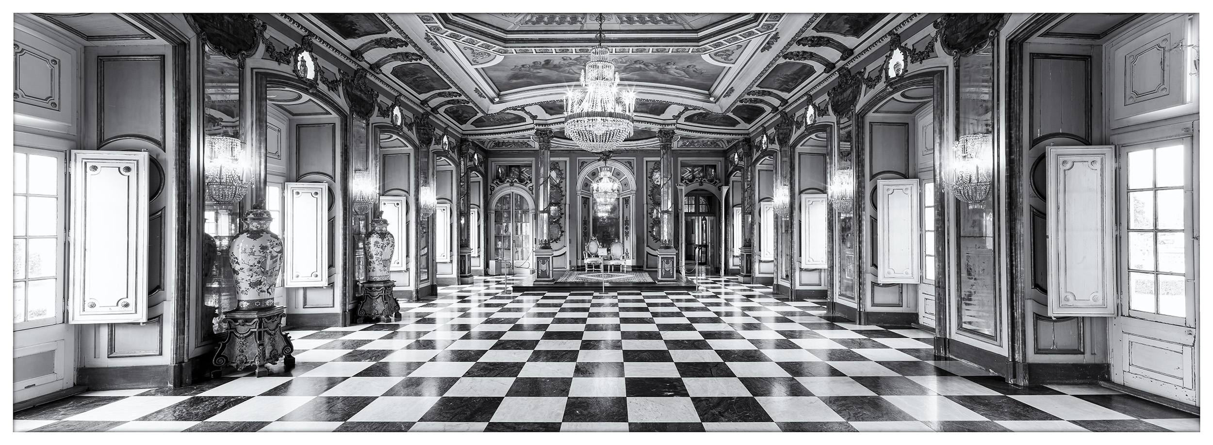 Regal Grandeur at Queluz Palace In Lisbon, Portugal, I captured this expansive black and white panoramic image within the Throne Room of Queluz Palace. The most...