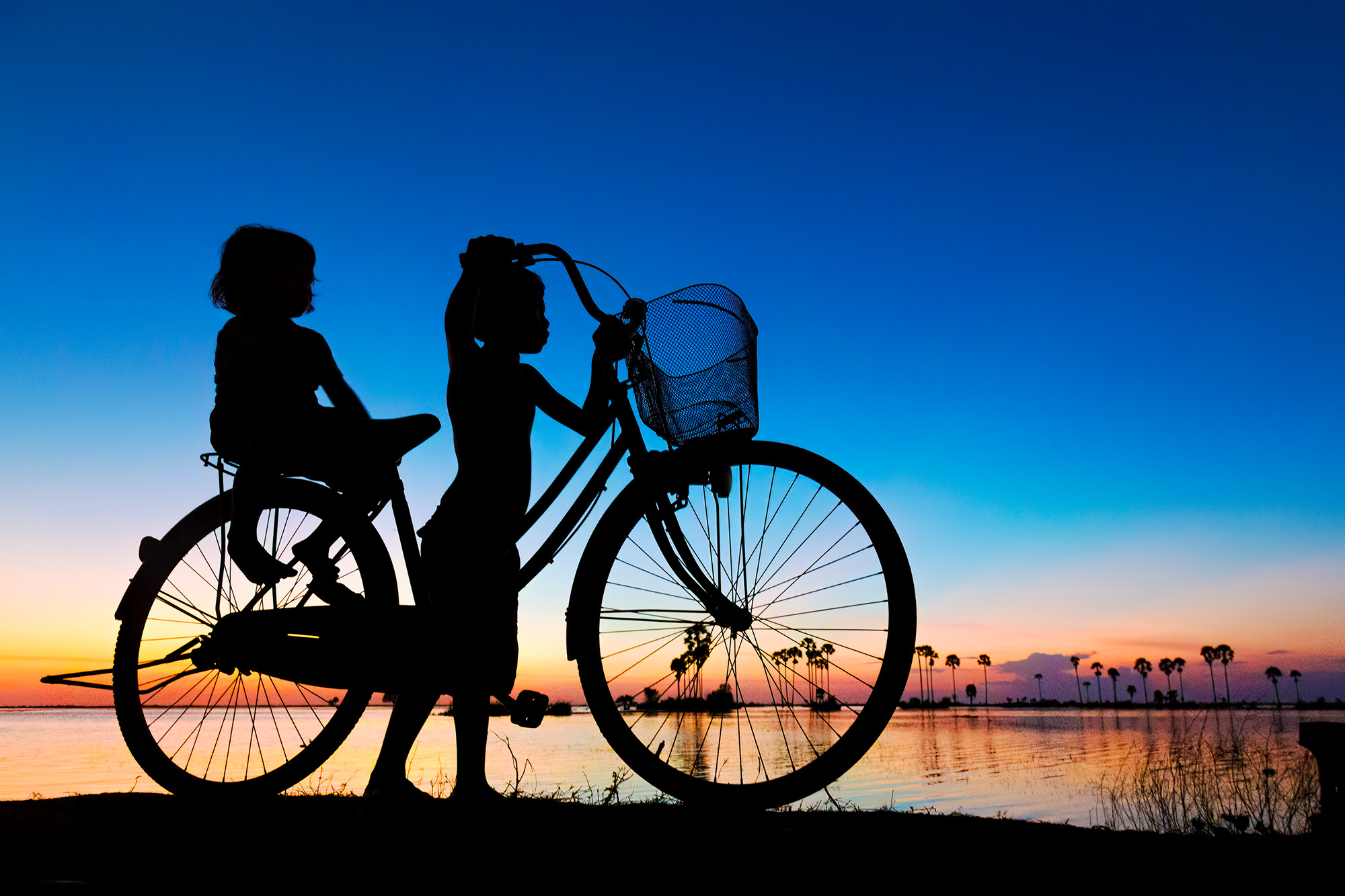 Brother & Sister This beautiful image was imagined by our friend and guide 'Ta'. He placed the kids with the bike and told us to 'hit the ground...