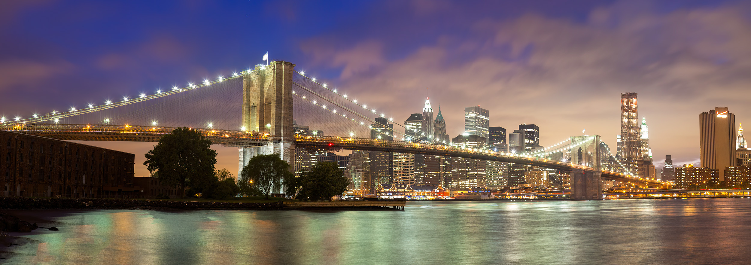 This panoramic image, carefully stitched together in Brooklyn, captures the Brooklyn Bridge in all its glory during the enchanting...