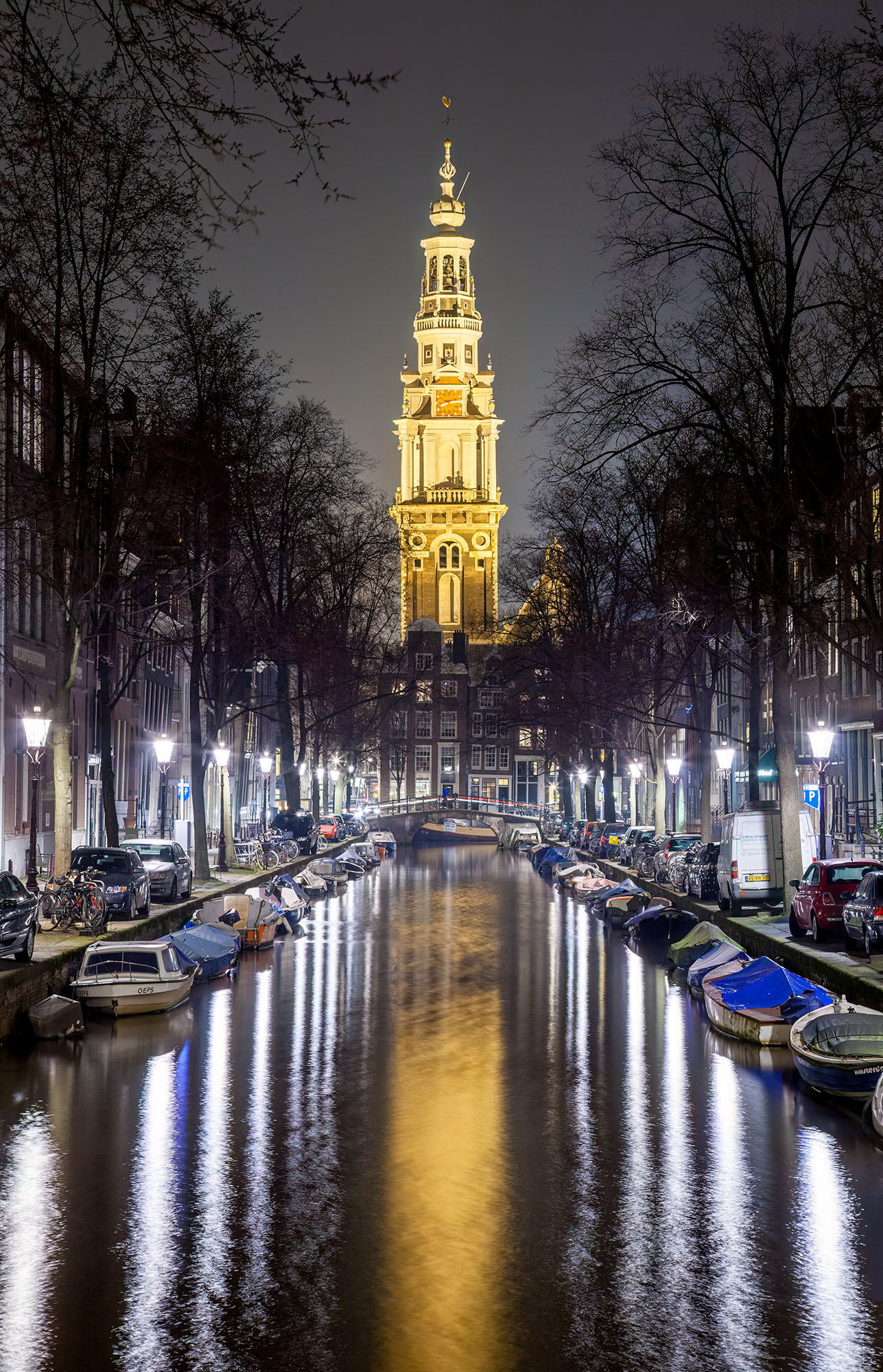 On a tranquil night in Amsterdam, I set my lens to capture the enchanting view of a canal stretching before me. The focal point...