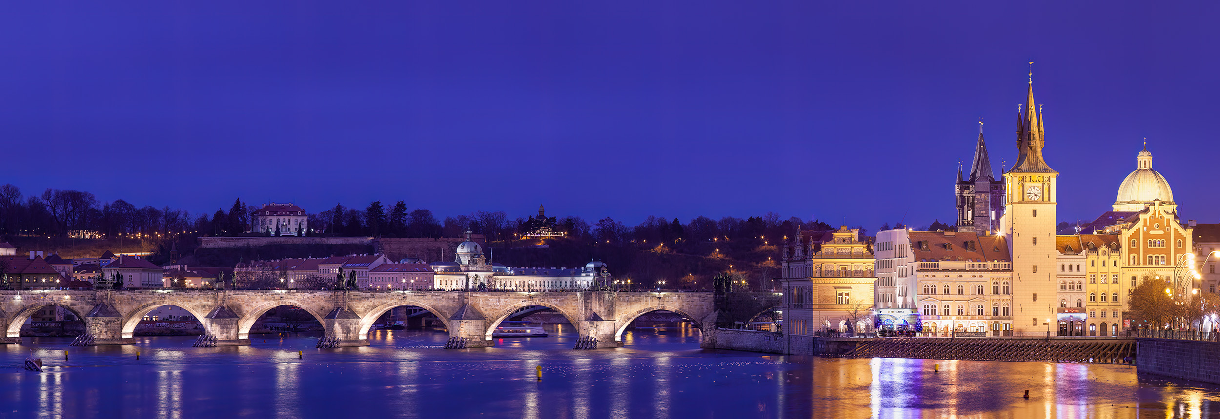From a vantage point across the Vltava River, I captured the timeless allure of the Charles Bridge during the tranquil hues of...