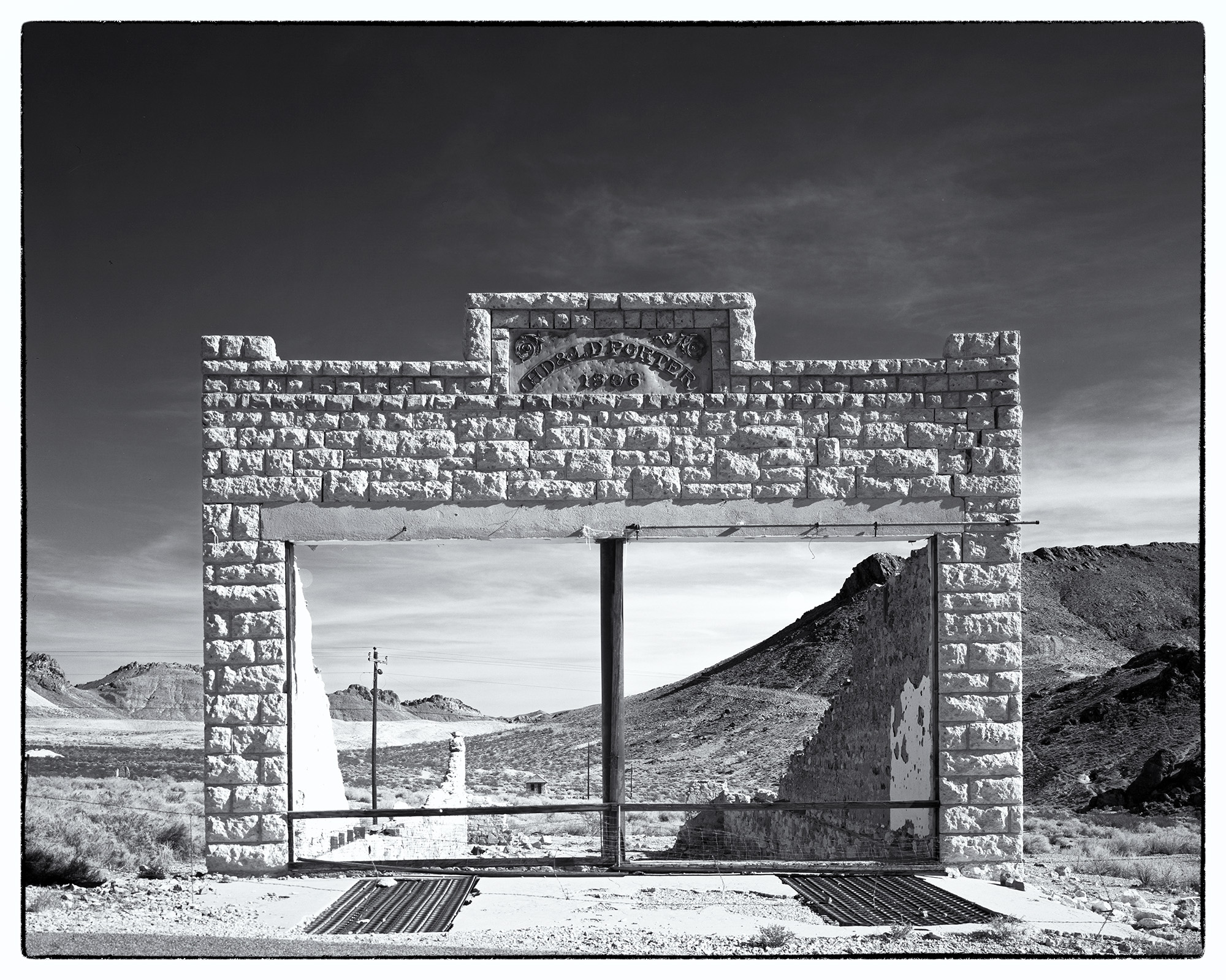 Rhyolite's Vanished Glory : Porter Building Captured on my Ebony SV45Te View Camera with Kodak TMax film, this image showcases the haunting remains of the Porter Building...