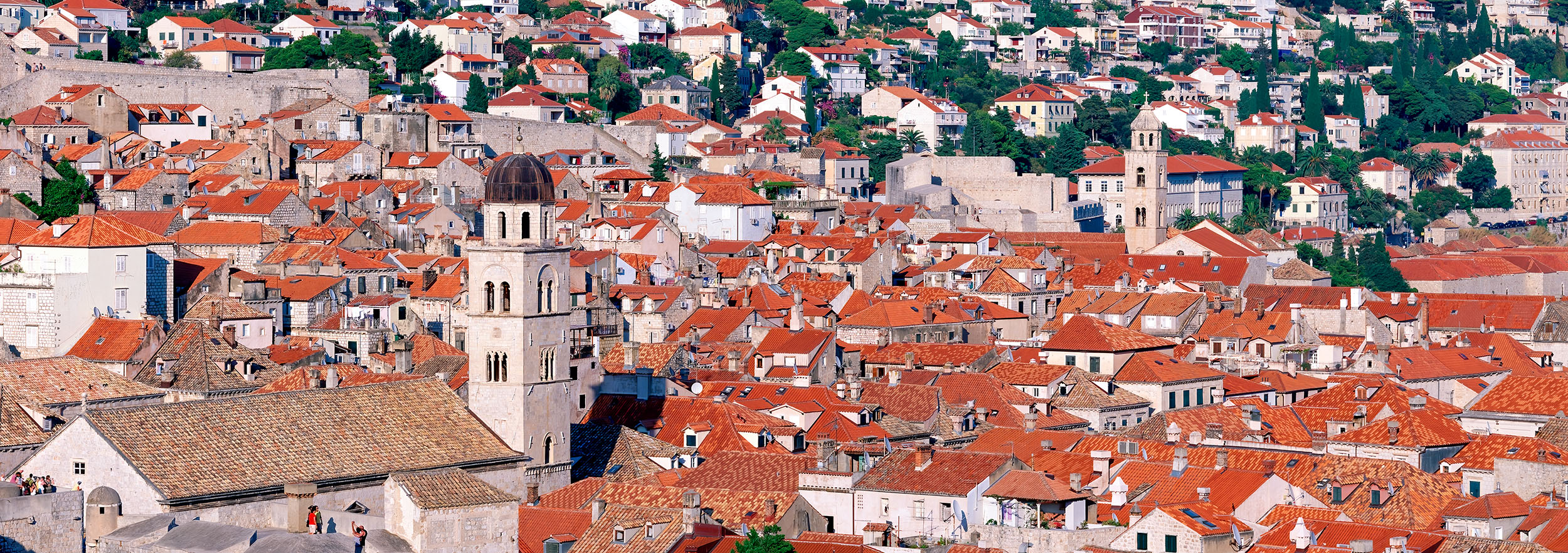 ""Dubrovnik Rooftop Tapestry" captures the enchanting panorama of the fortified medieval city of Dubrovnik, Croatia. This horizontal...