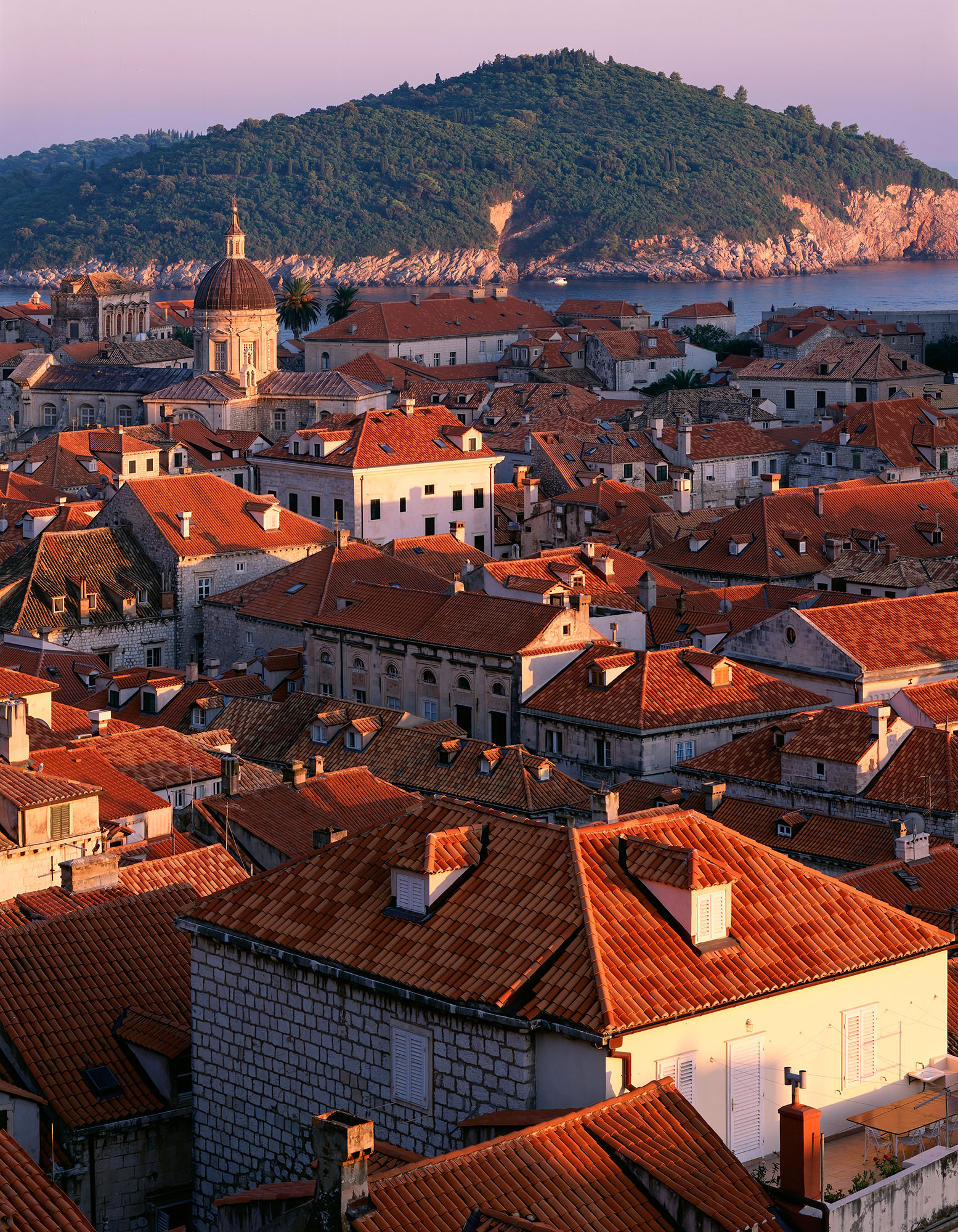 Dubrovnik Rooftop Sunset "Dubrovnik Rooftop Sunset" is a stunning vertical composition captured in Dubrovnik, Croatia. This image was meticulously taken...