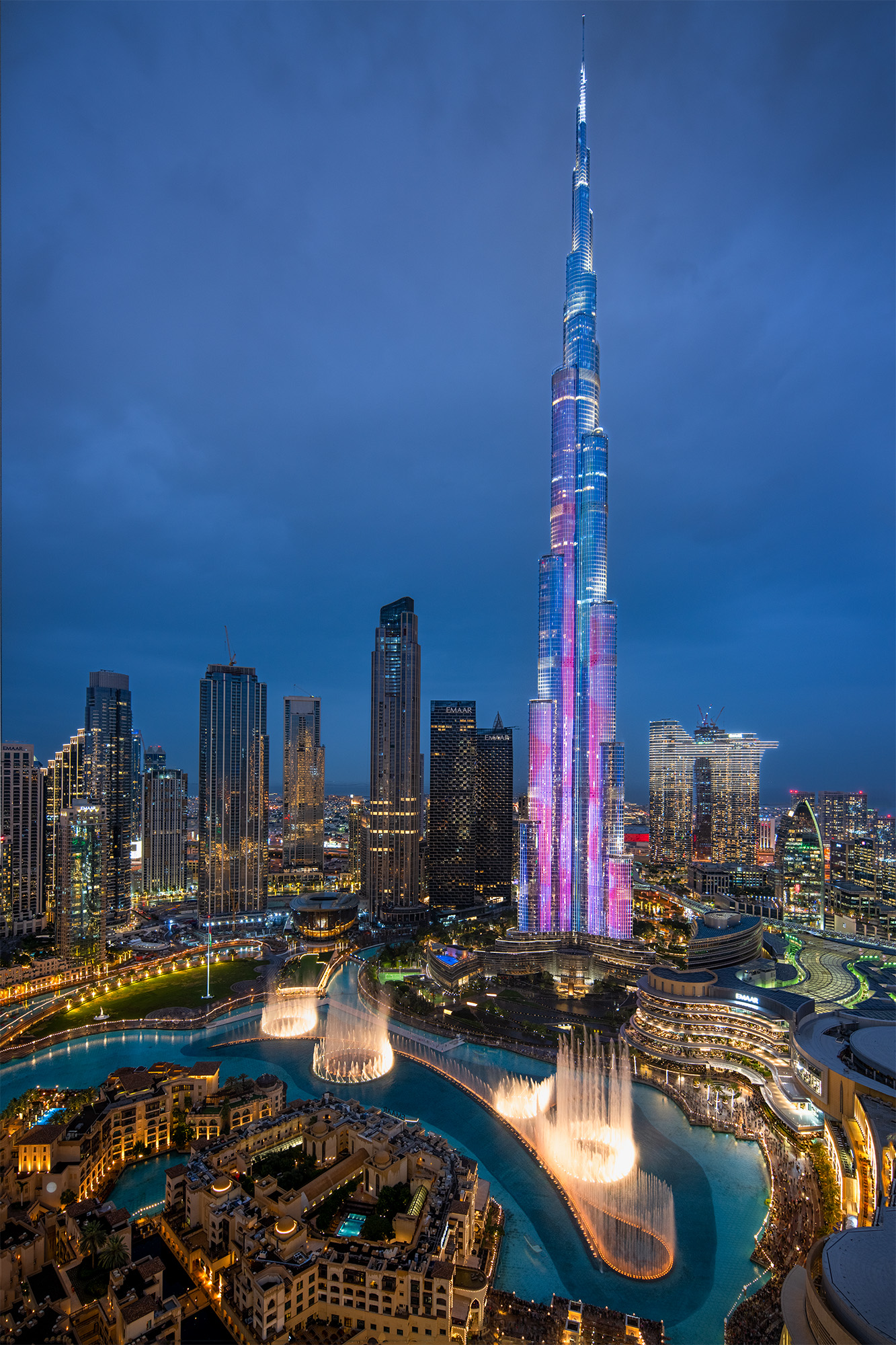 At sunset the Burj Khalifa goes through a combined light show with some of the tallest fountains in the world.  This image is...